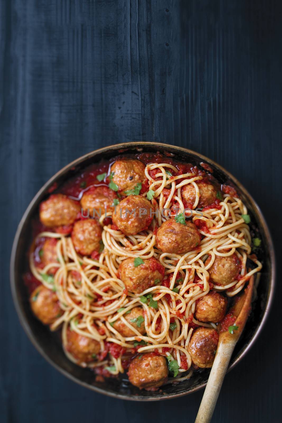 close up of rustic meatball spaghetti in tomato sauce