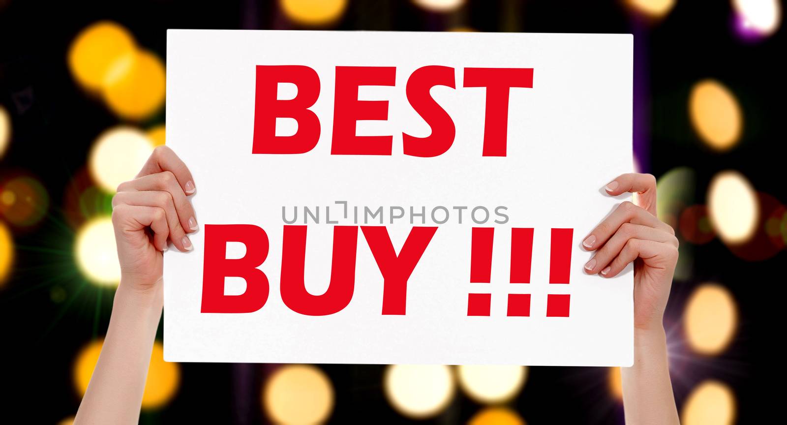 Best Buy! Female hands holding a placard with abstract lights bokeh background. Commercial appeal concept