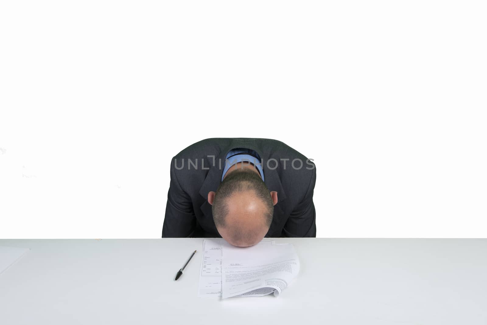 a worried man reads a document