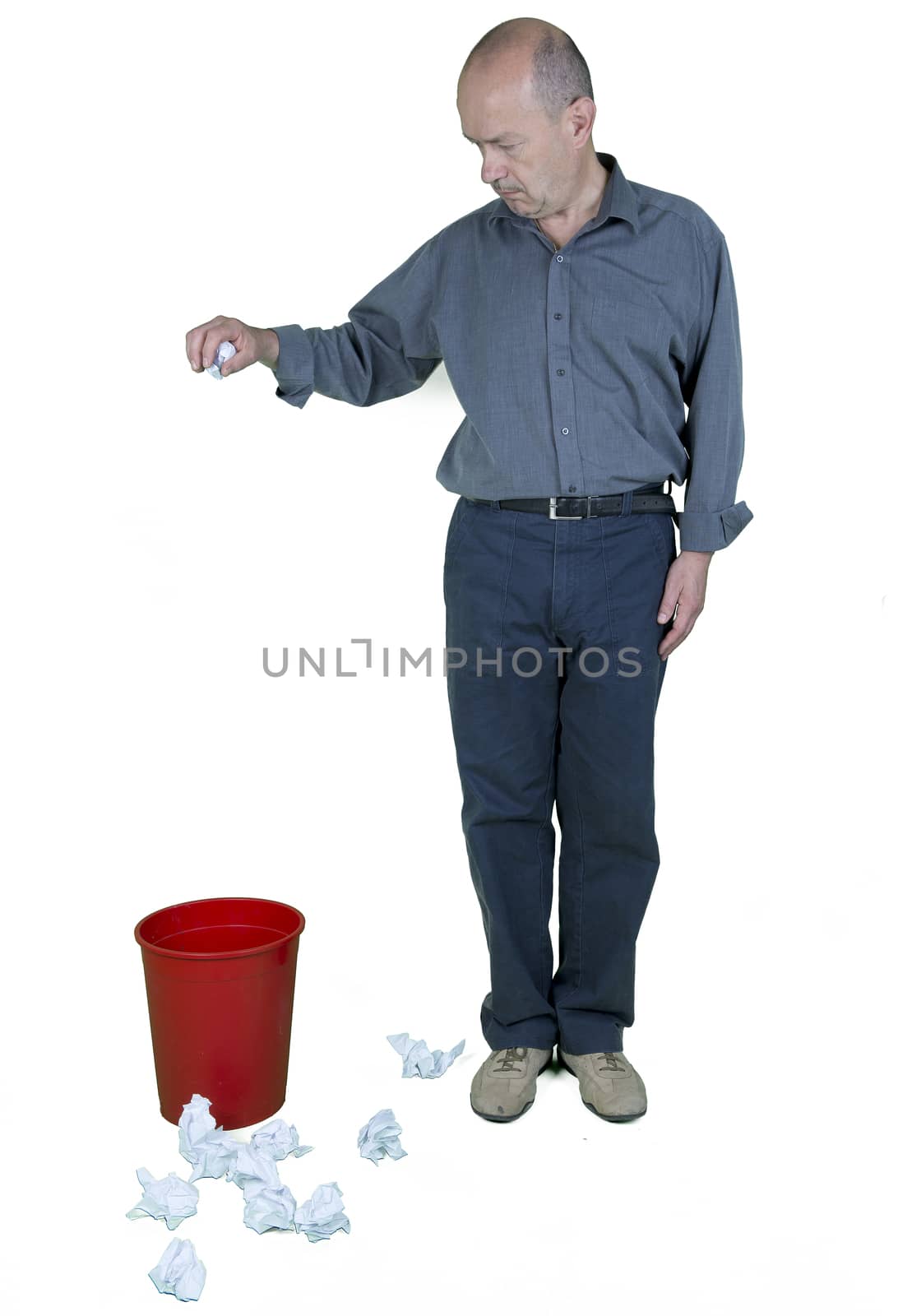 a man and a wastebasket