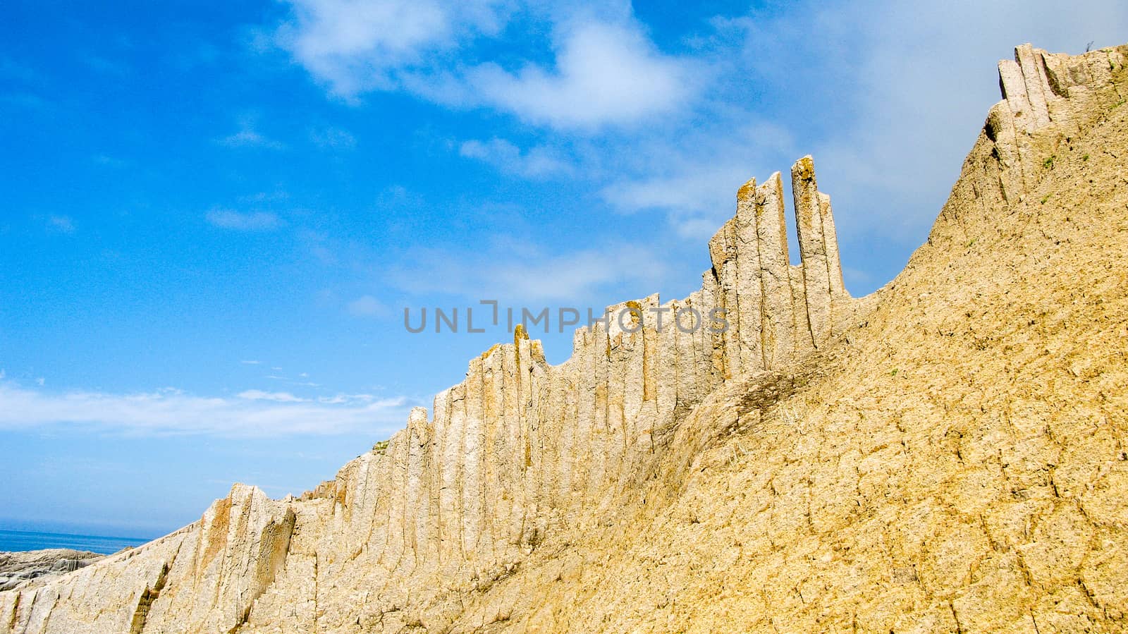 Rocks of Stolbchatiy cape in Kunashir, Kuril islands, Russia