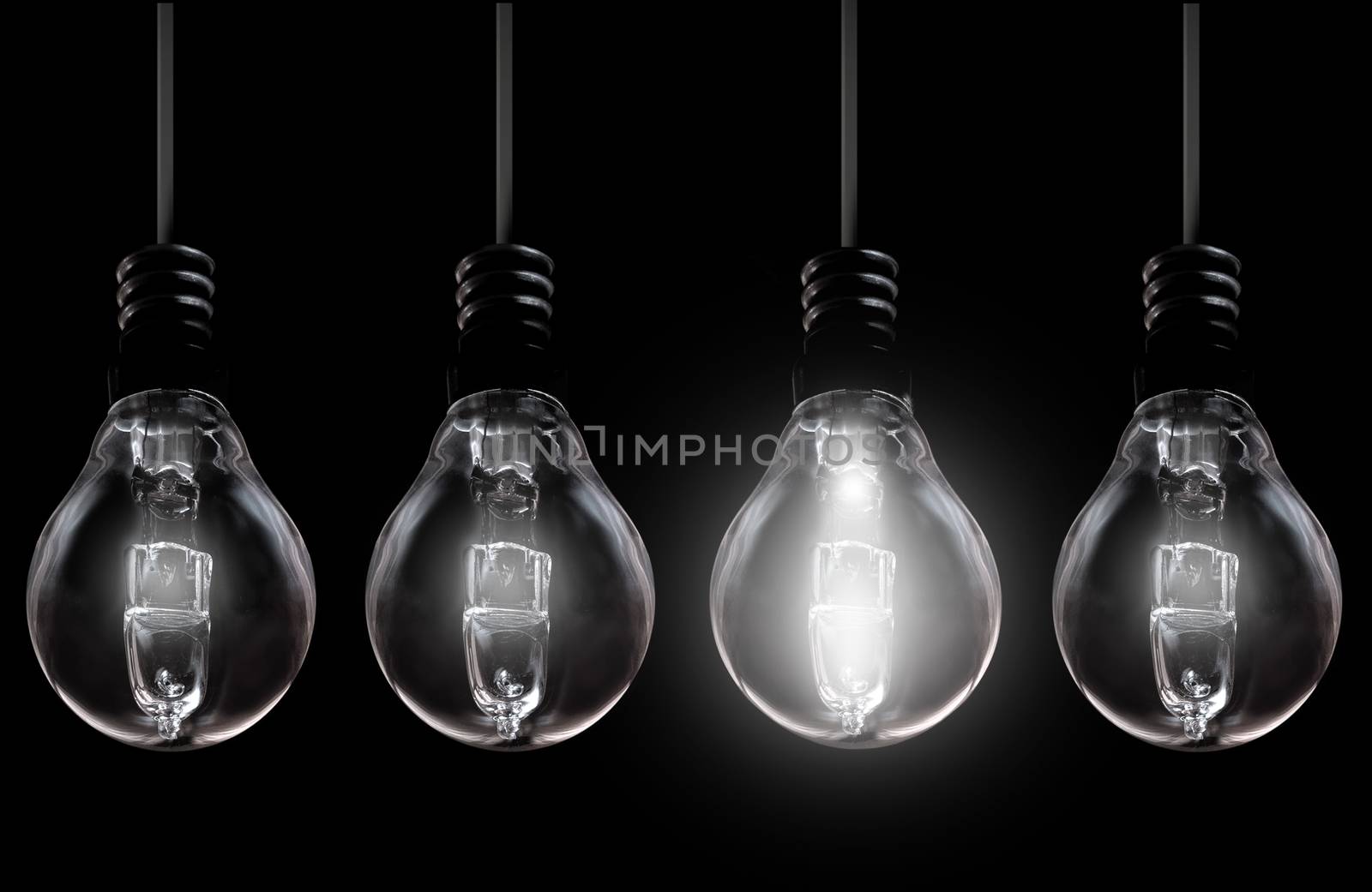 Light bulb amongst unlit by unikpix