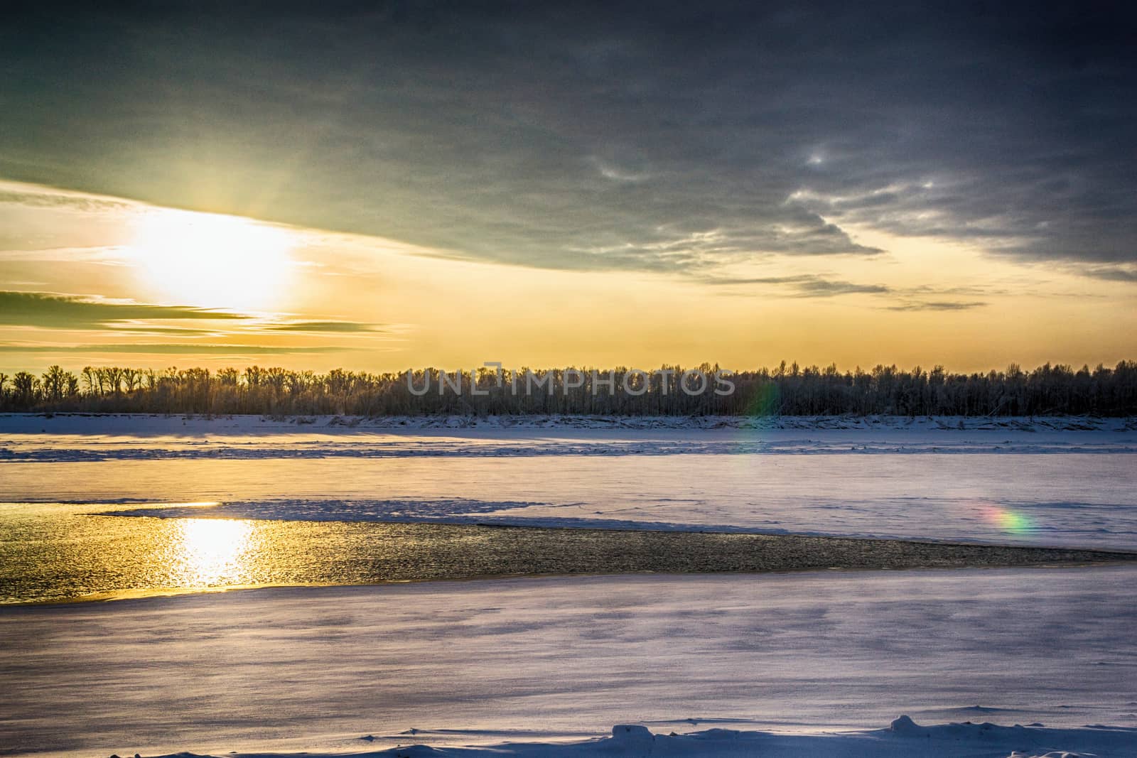 sunset on the river in winter river Dec frozen water forest