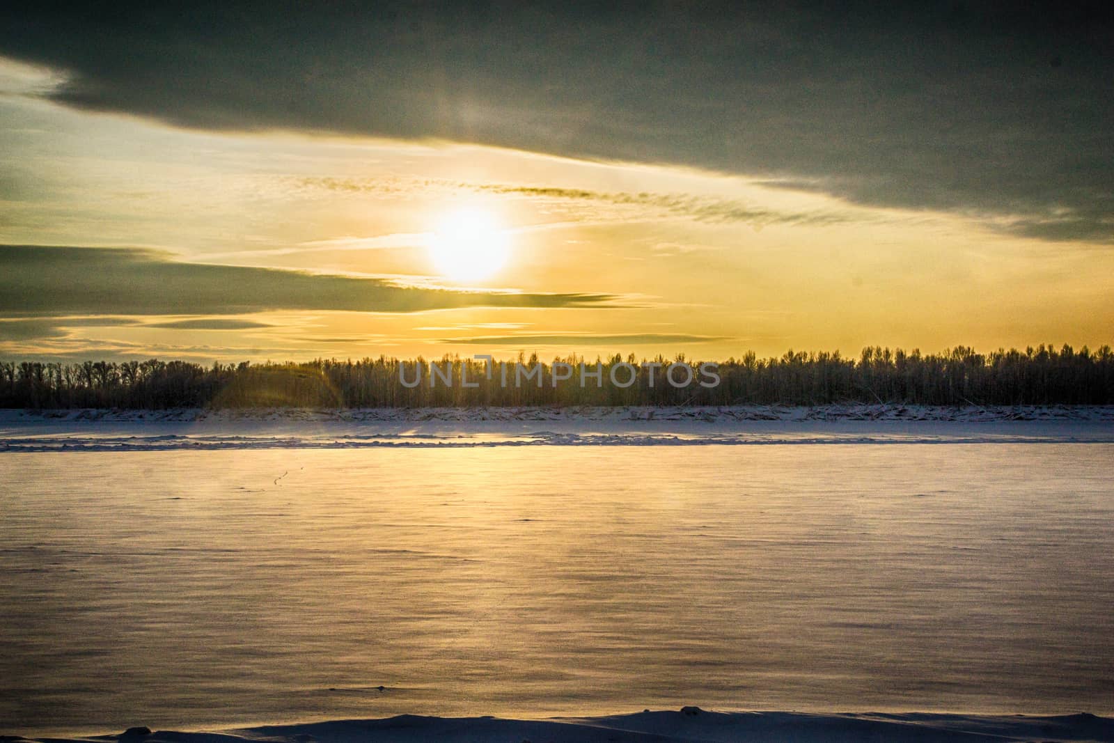 sunset on the river in winter river Dec frozen water forest