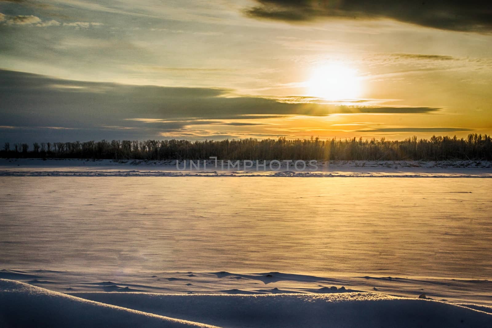 sunset on the river in winter river Dec frozen water forest