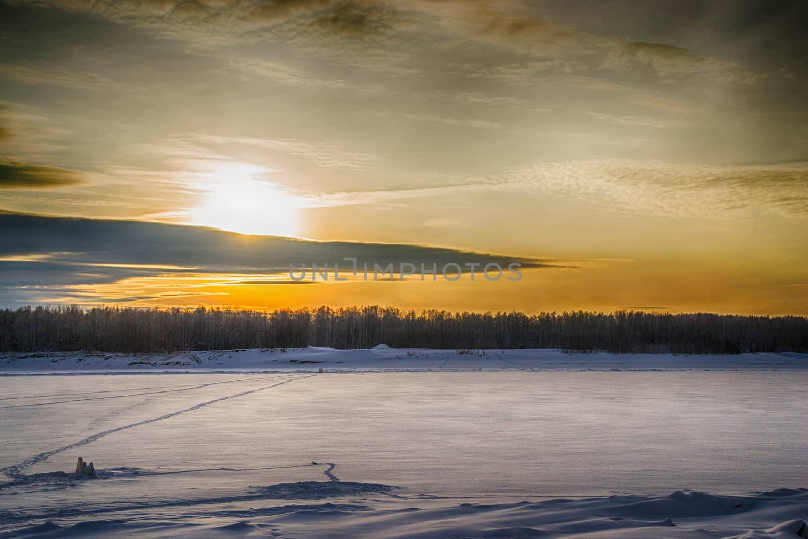 sunset on the river in winter river Dec frozen water forest