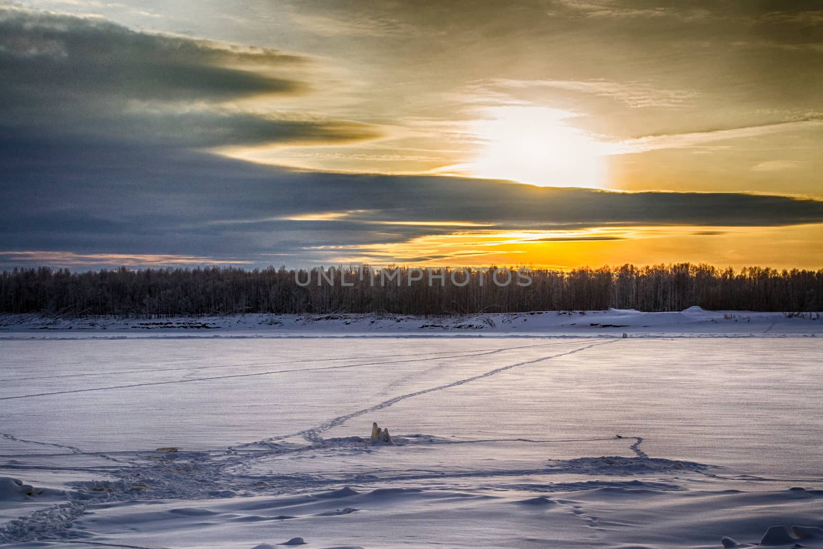 sunset on the river in winter river Dec frozen water forest