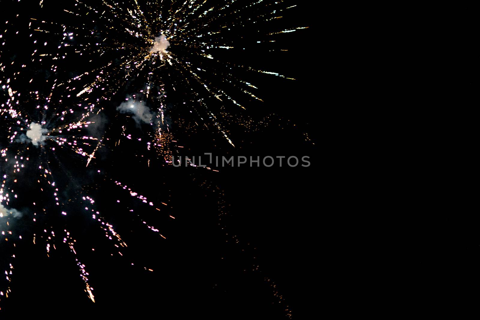 fireworks explosion of color on a dramatic black background focus