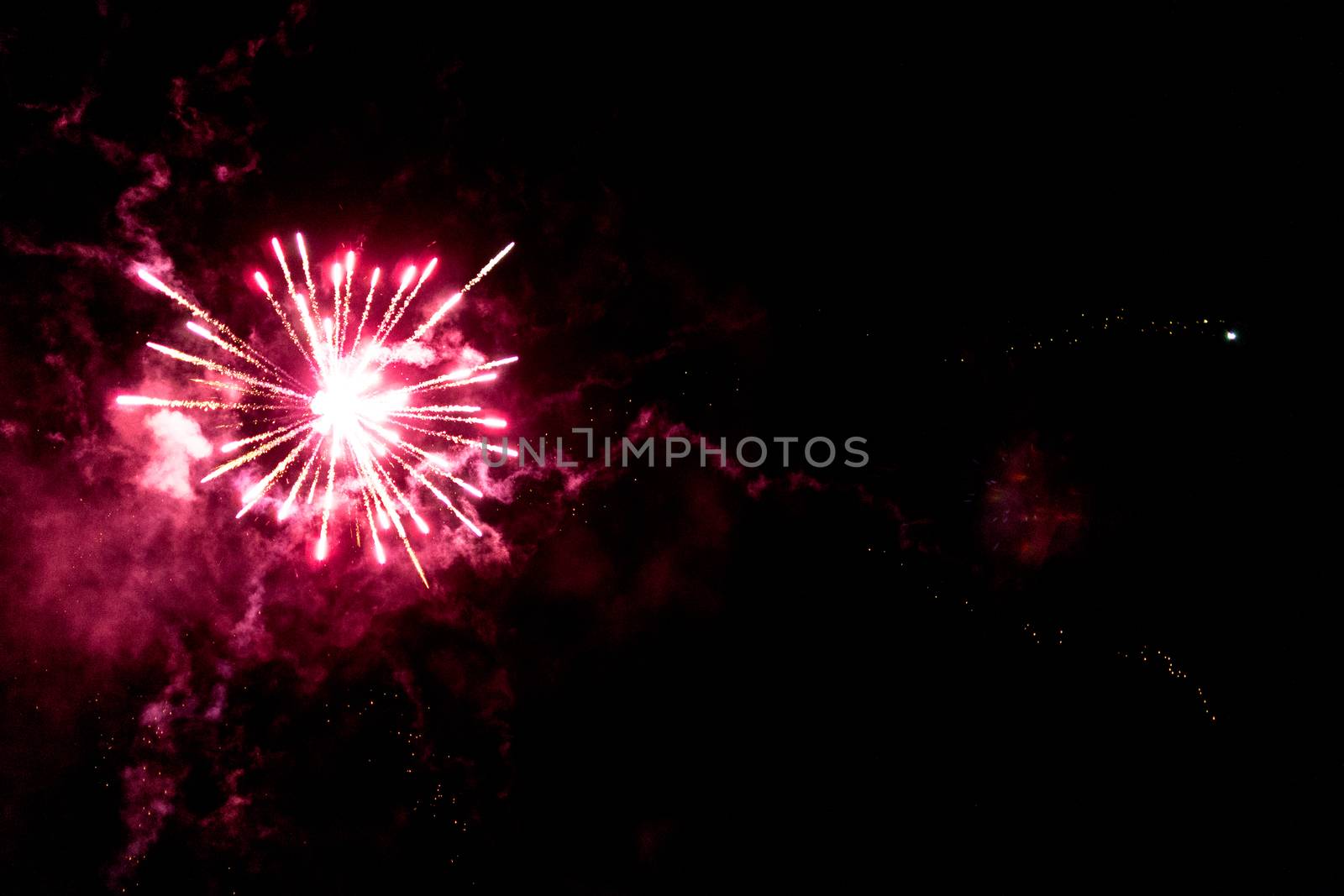 fireworks explosion of color on a dramatic black background focus