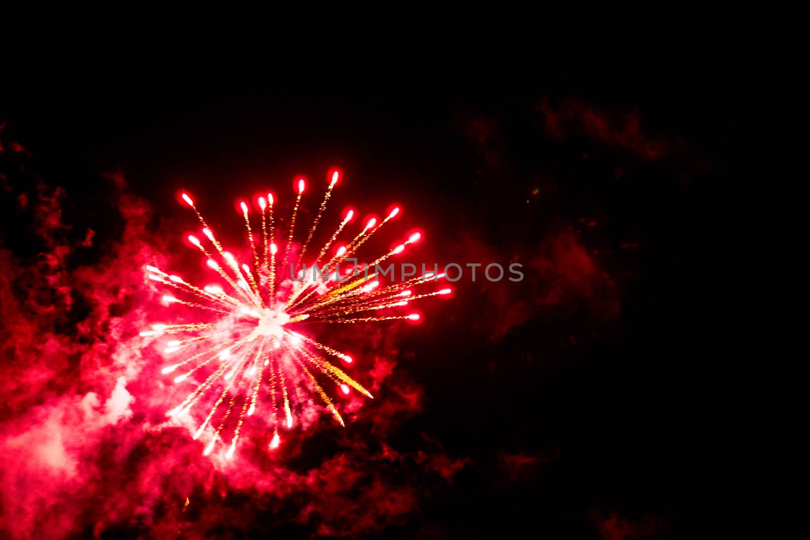 fireworks explosion of color on a dramatic black background focus