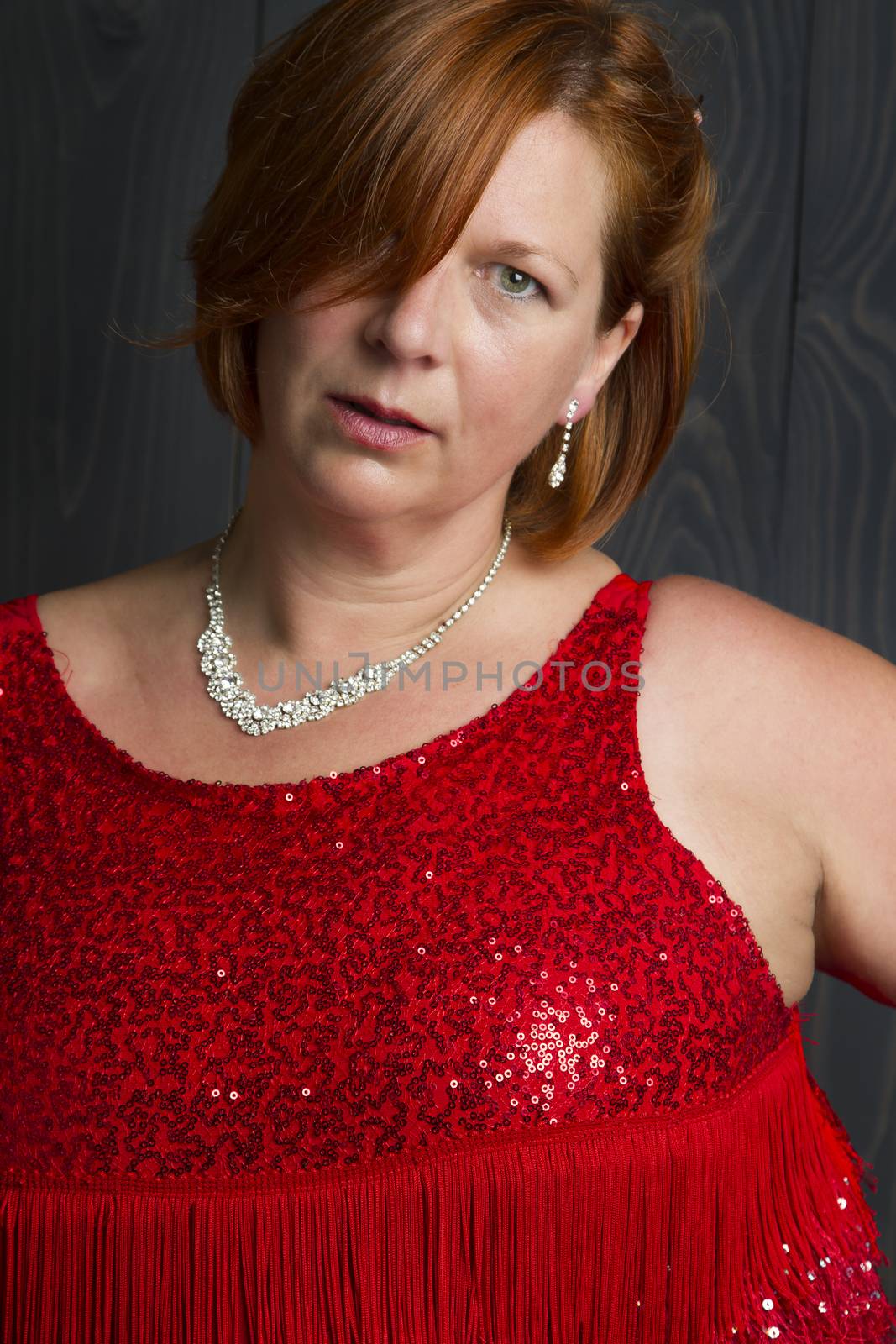 overweight forty something wearing a sparkly red dress