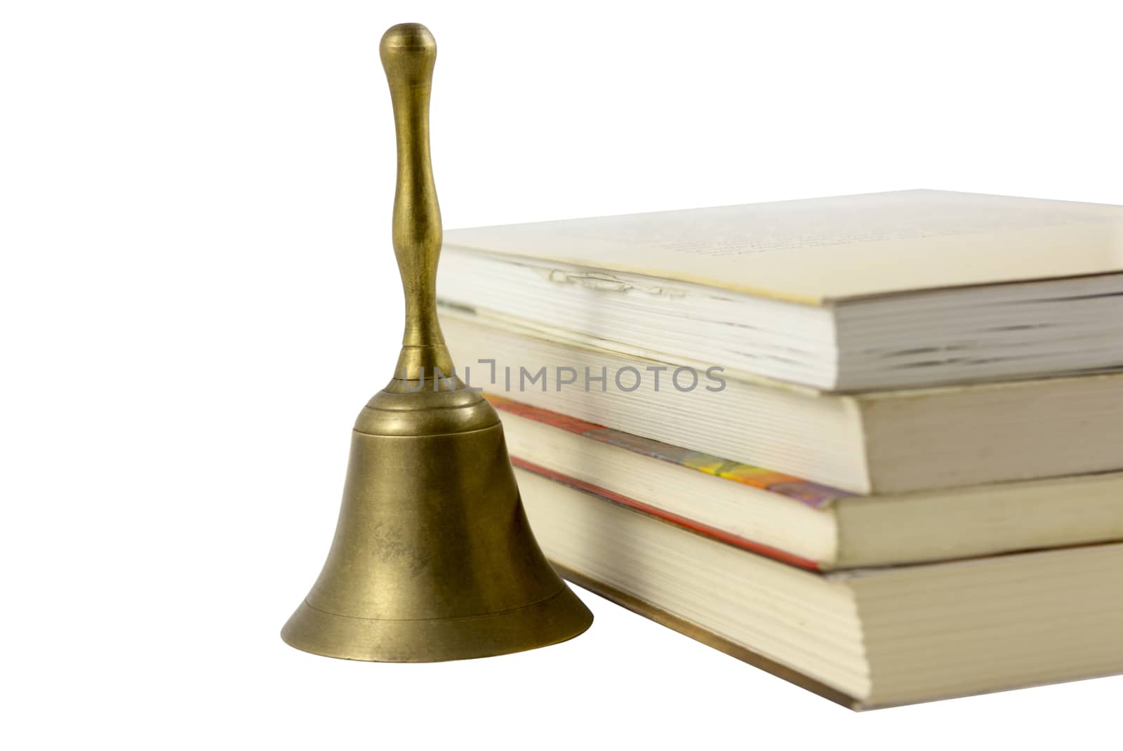 old bell with stack of books