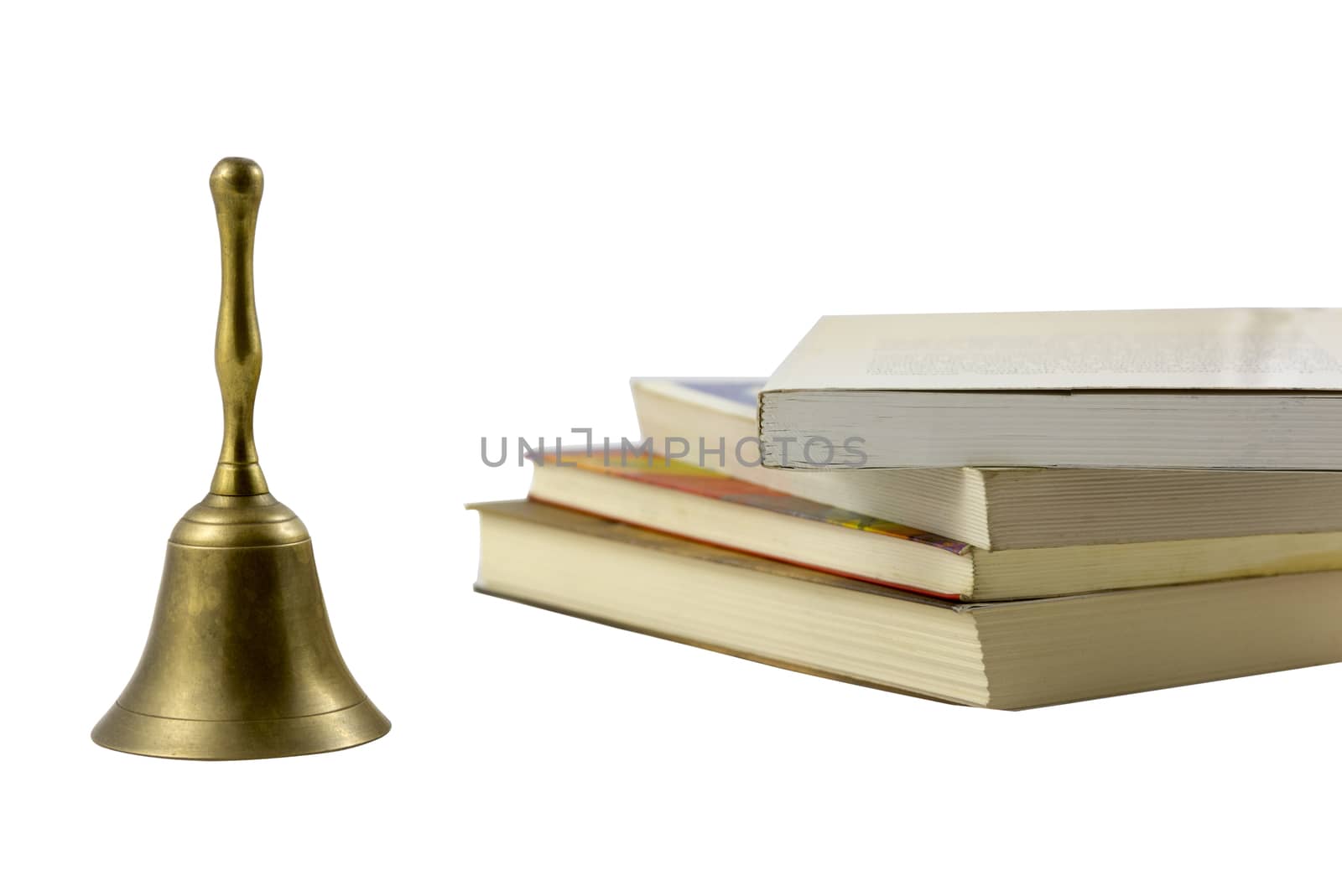 old bell with stack of books