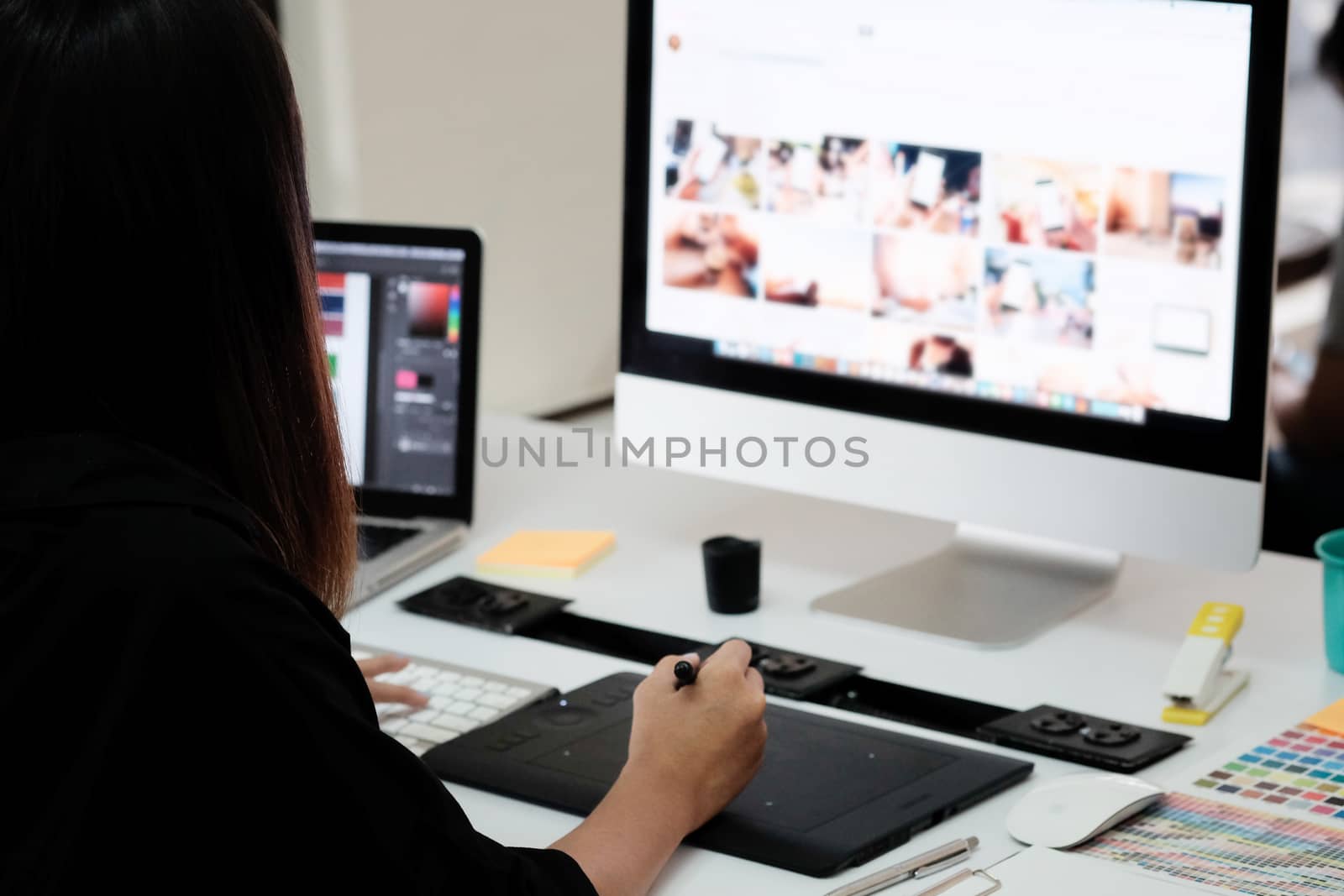 Graphic designer woman working on creative office with create graphic on computer.