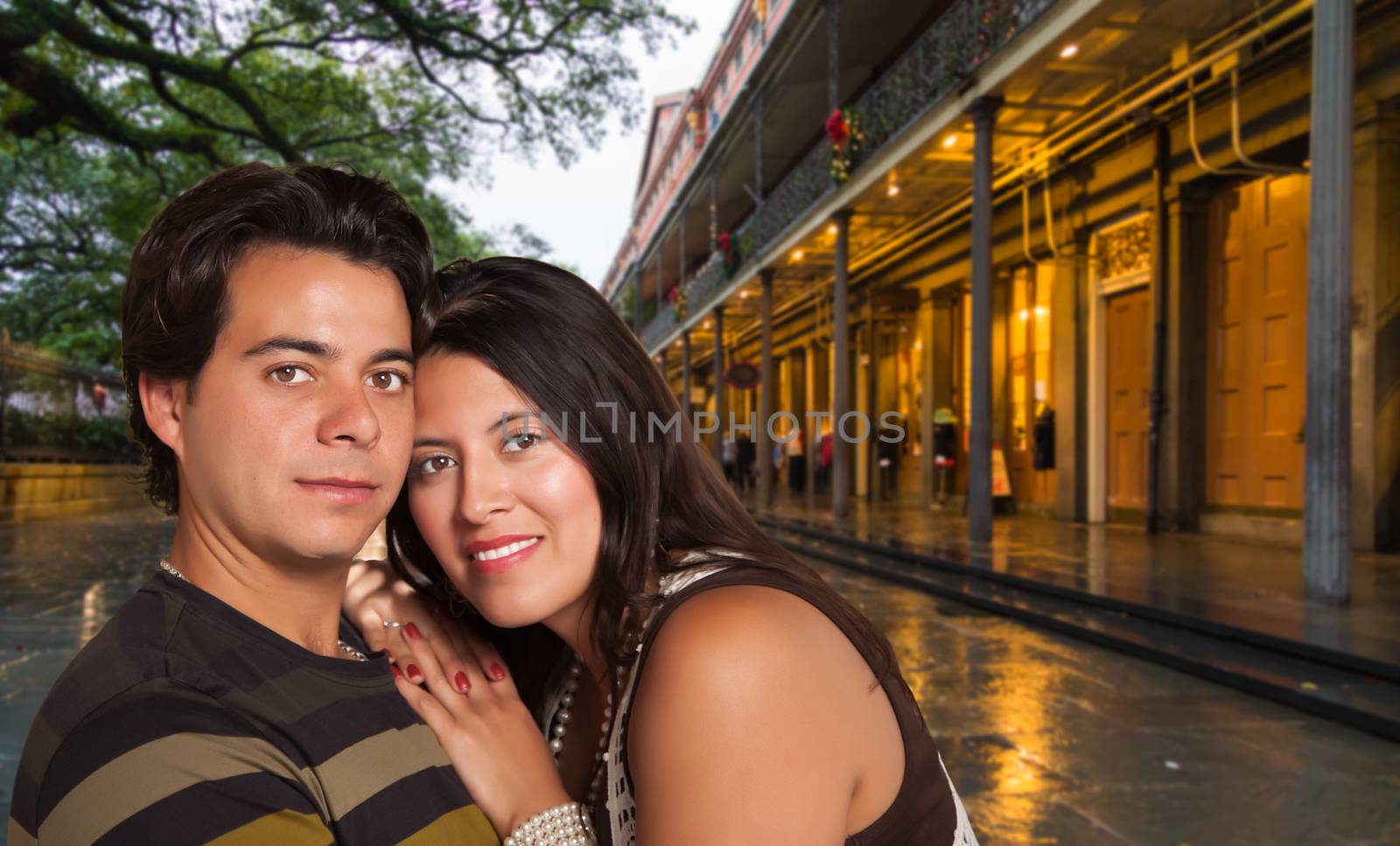 Happy Hispanic Couple Enjoying an Evening in New Orleans, Louisiana by Feverpitched