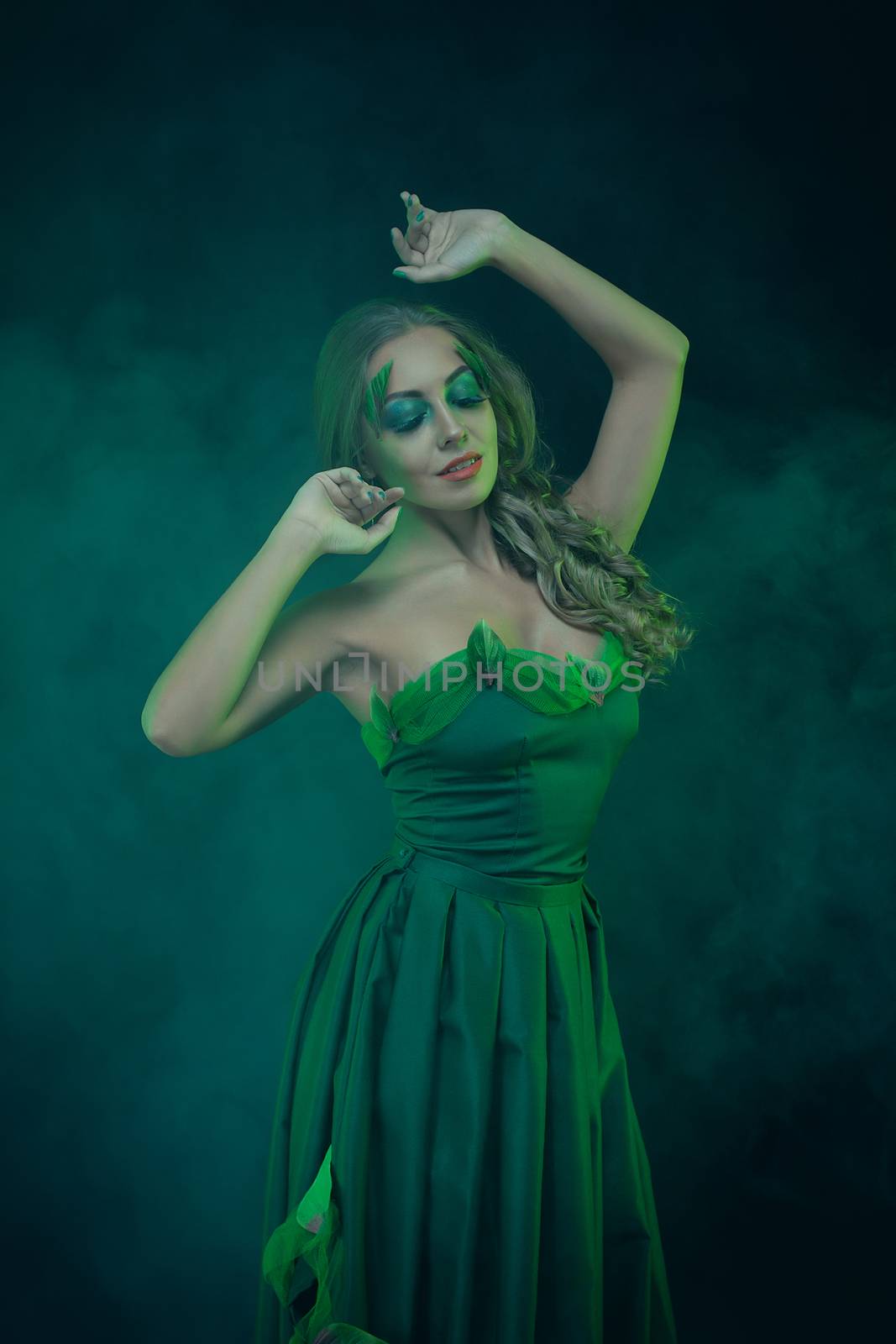 Fashion Art Portrait .Green Make-up and Colorful Bright Nails.