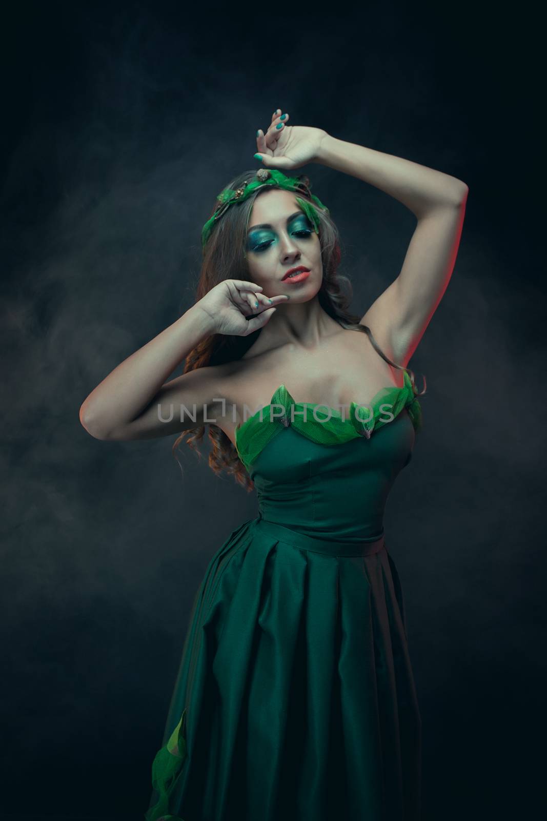 Fashion Art Portrait .Green Make-up and Colorful Bright Nails.