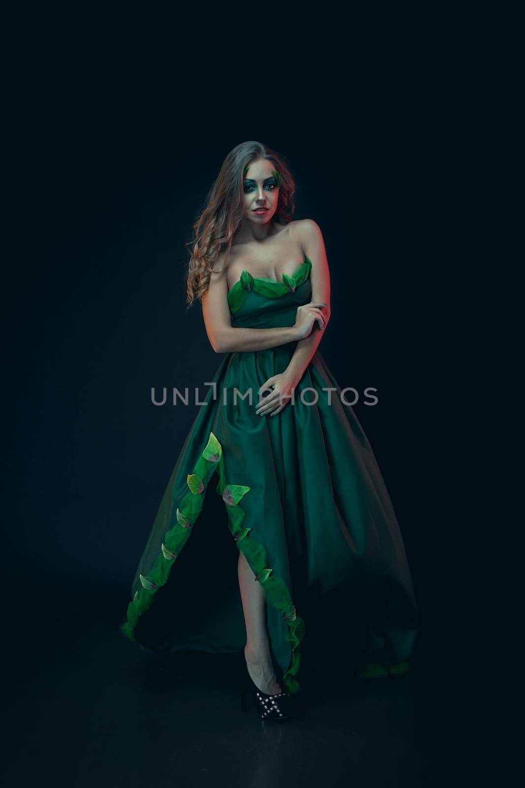 Fashion Art Portrait .Green Make-up and Colorful Bright Nails.