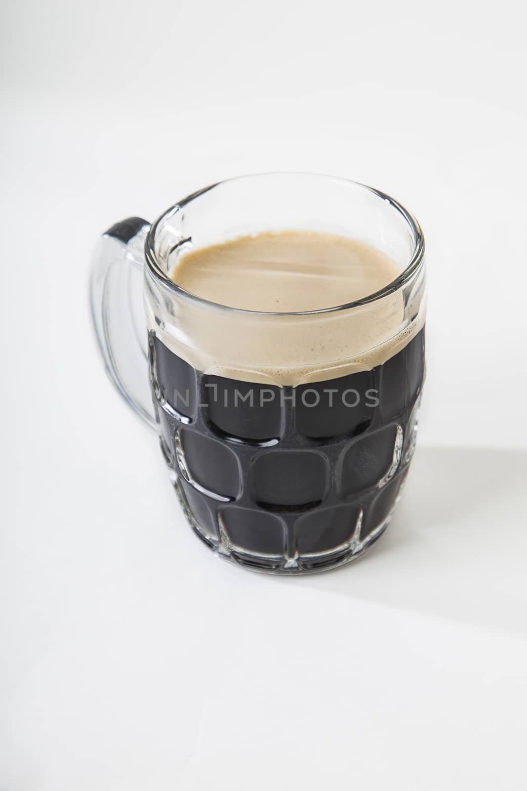 Stout beer in a mug by mypstudio