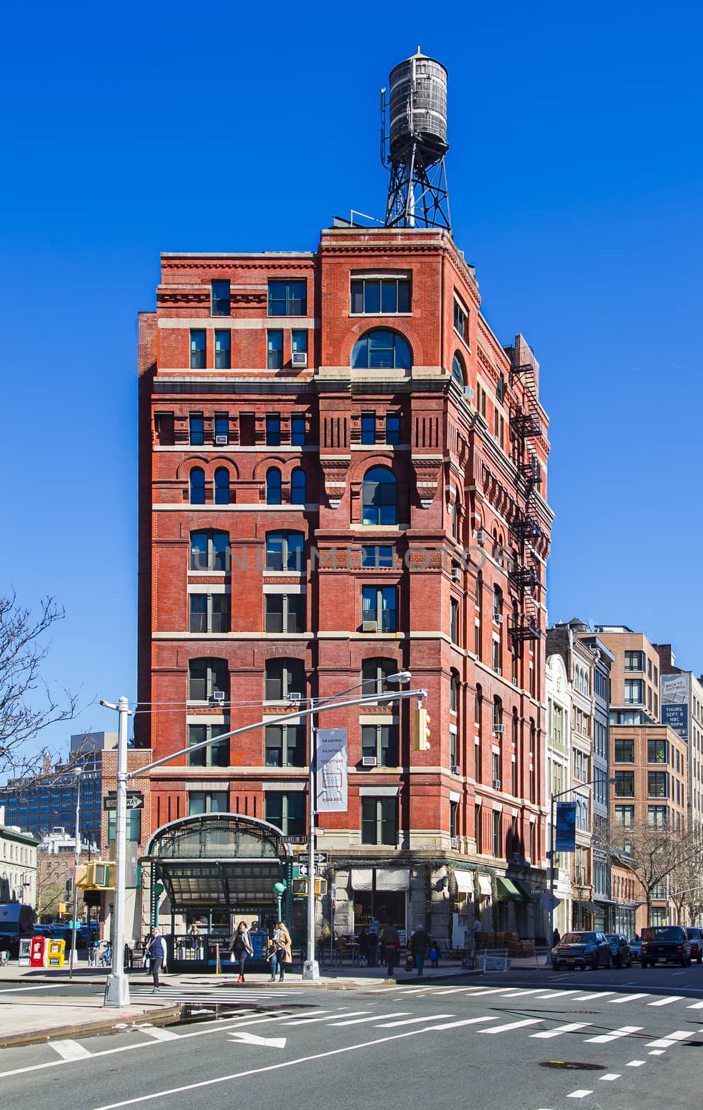 Red brick building against blue sky in New York city