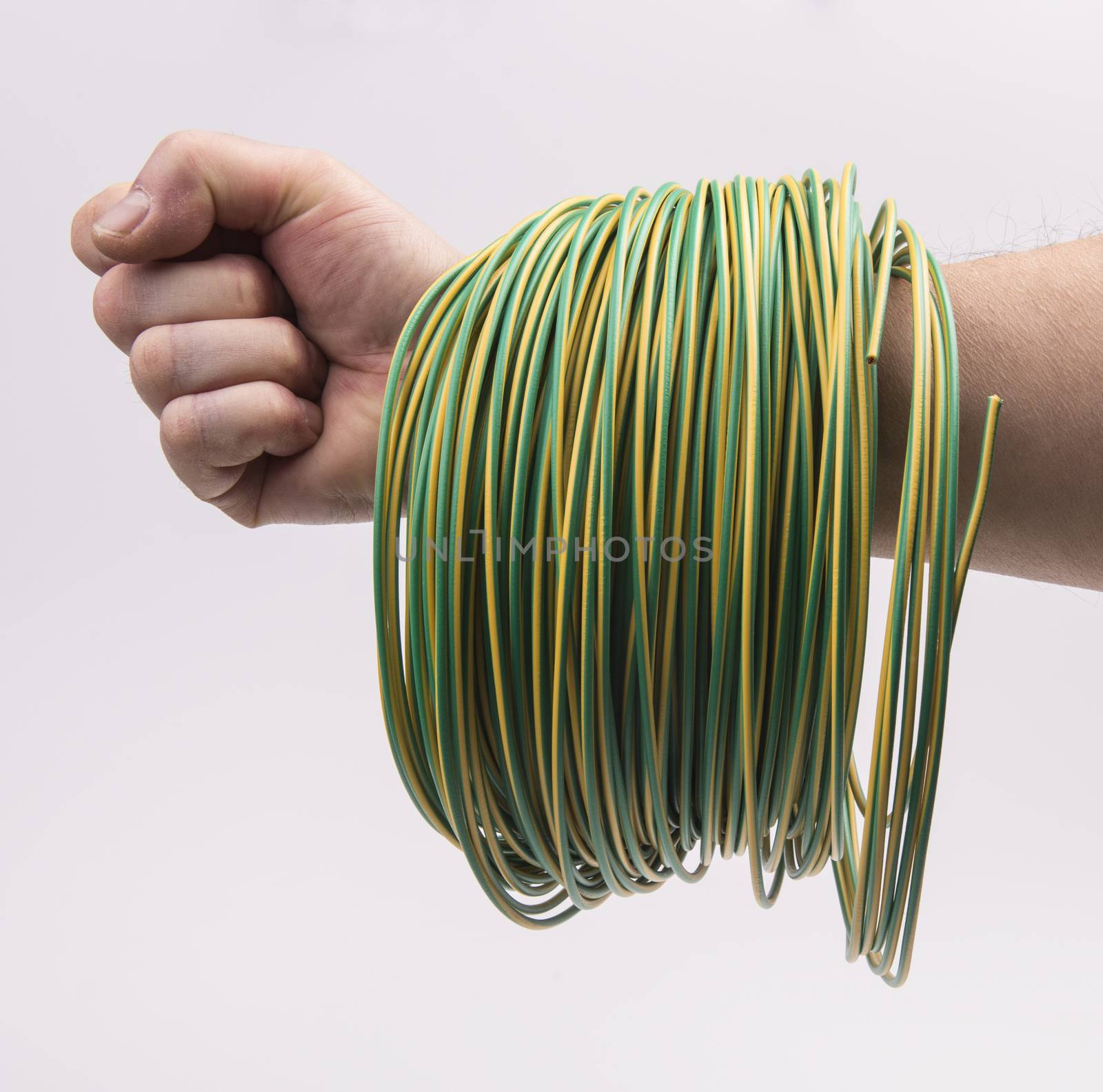 a skein of colored electric wire in hand