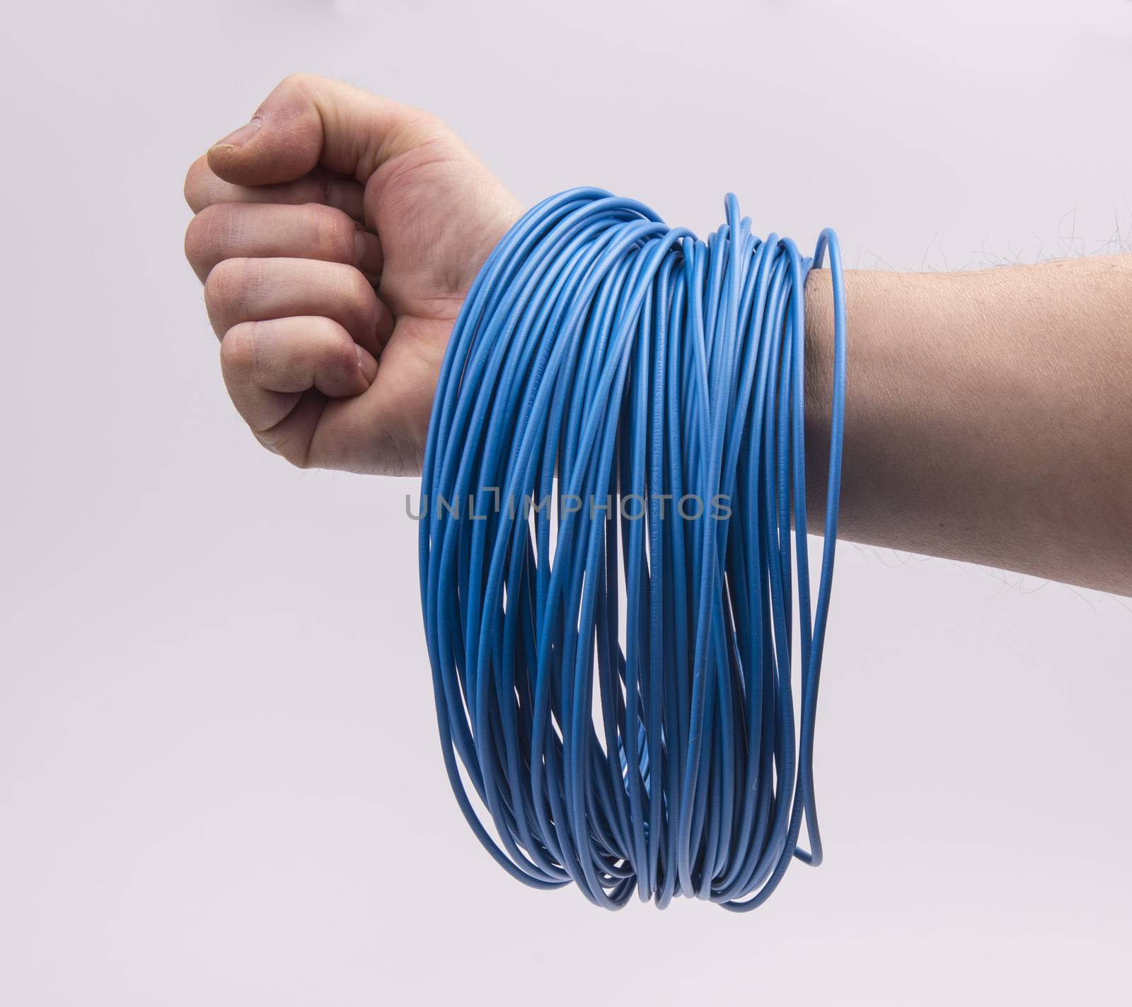 a skein of colored electric wire in the hand