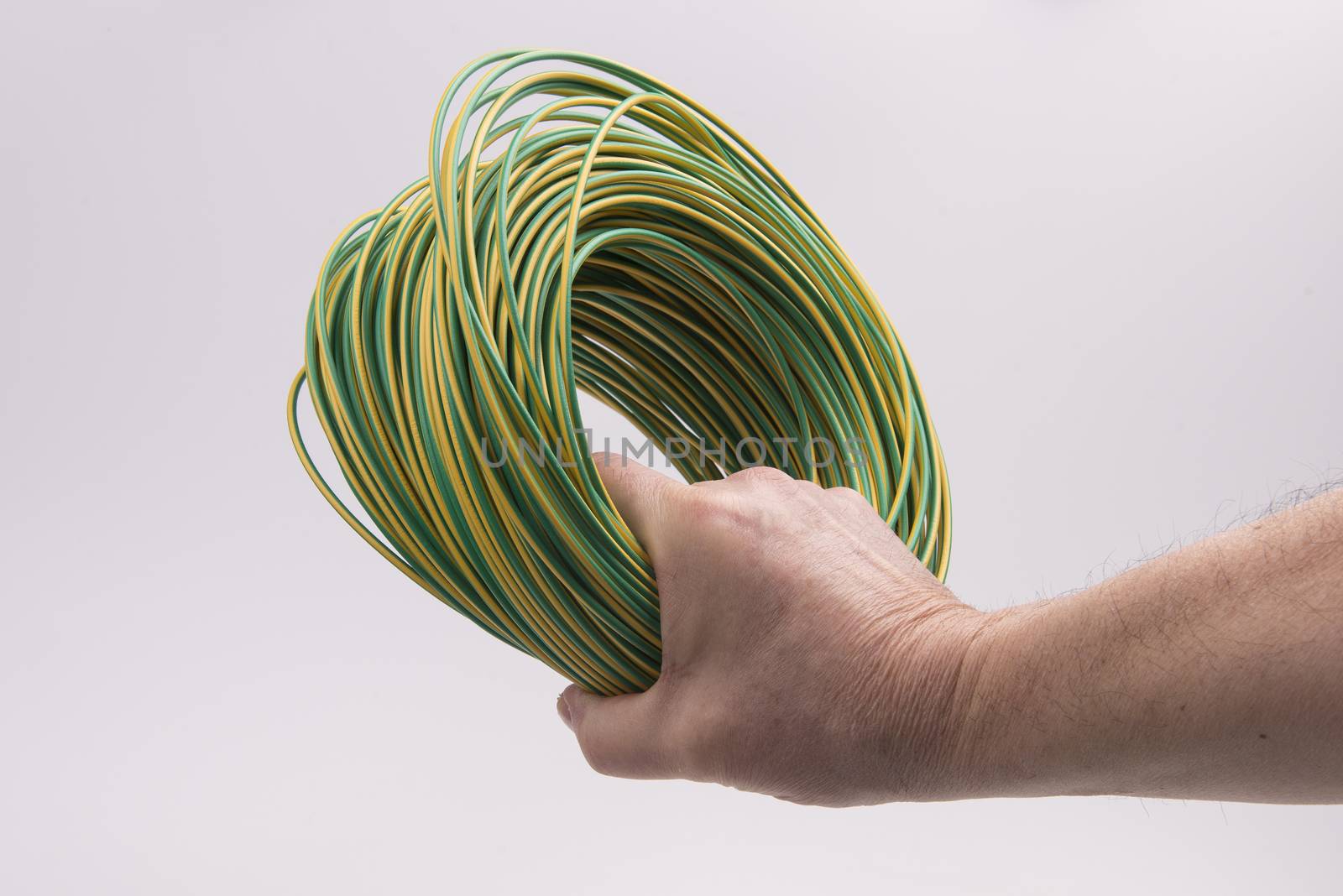 a skein of colored electric wire in the hand