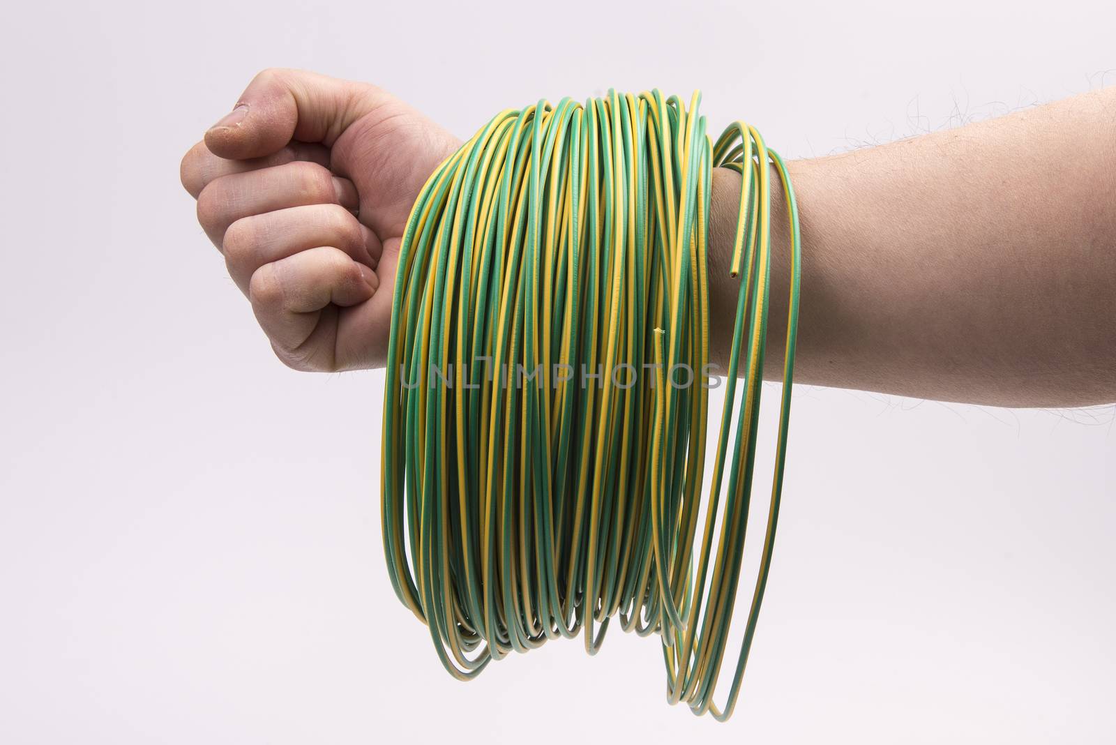 a skein of colored electric wire in the hand