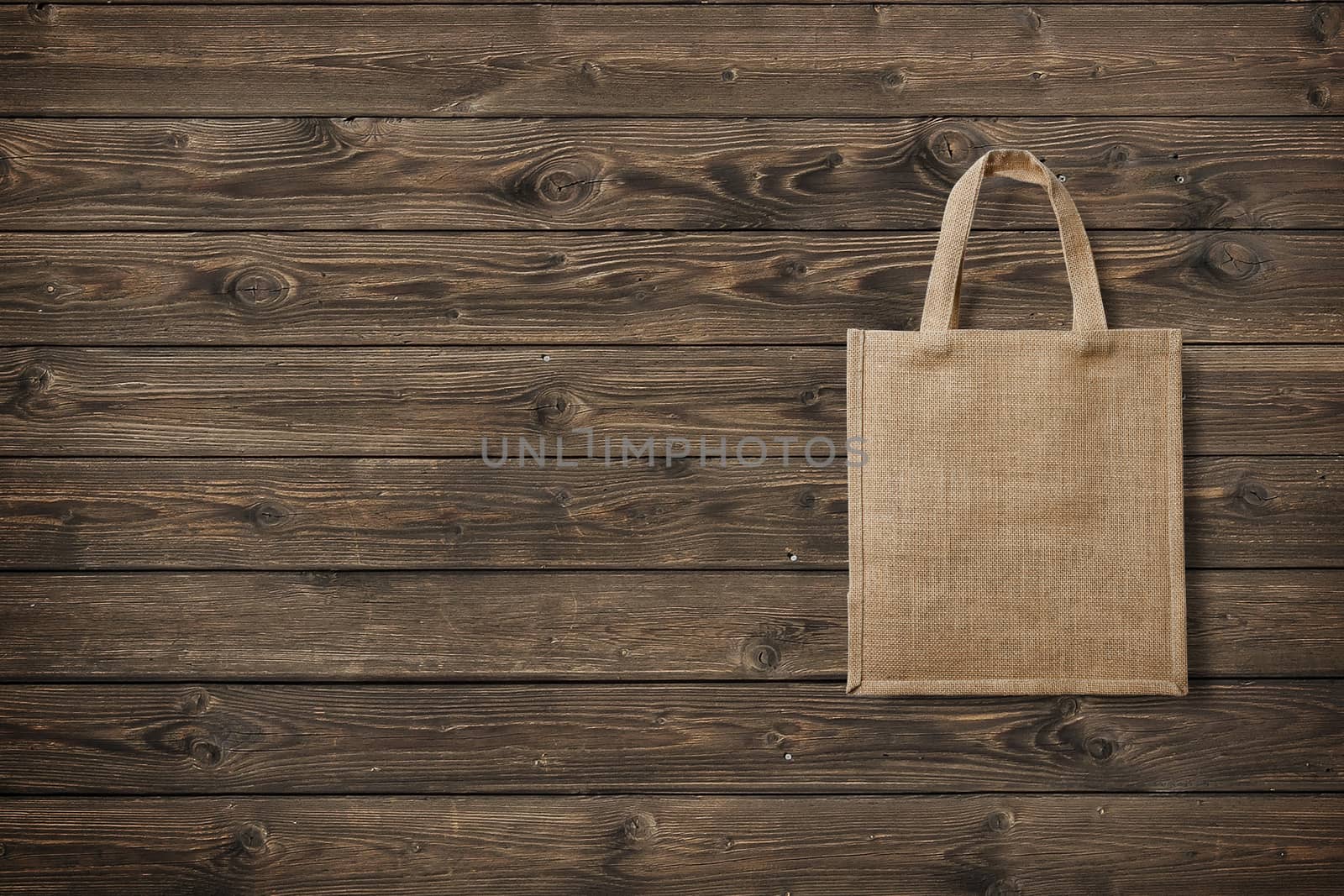 eco bag for shopping on wooden background by boys1983@mail.ru