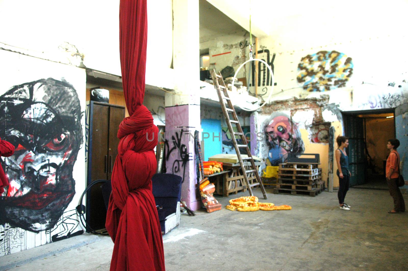 Colorful spacious art studio with many drawings