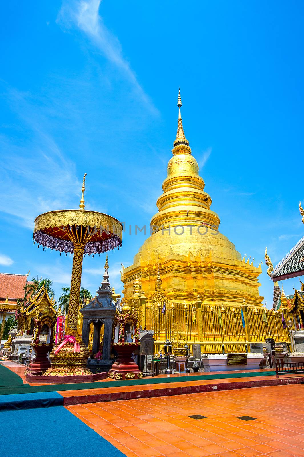 Wat Phrathat Hariphunchai Golden pagoda in Lamphun,Thailand. by gutarphotoghaphy