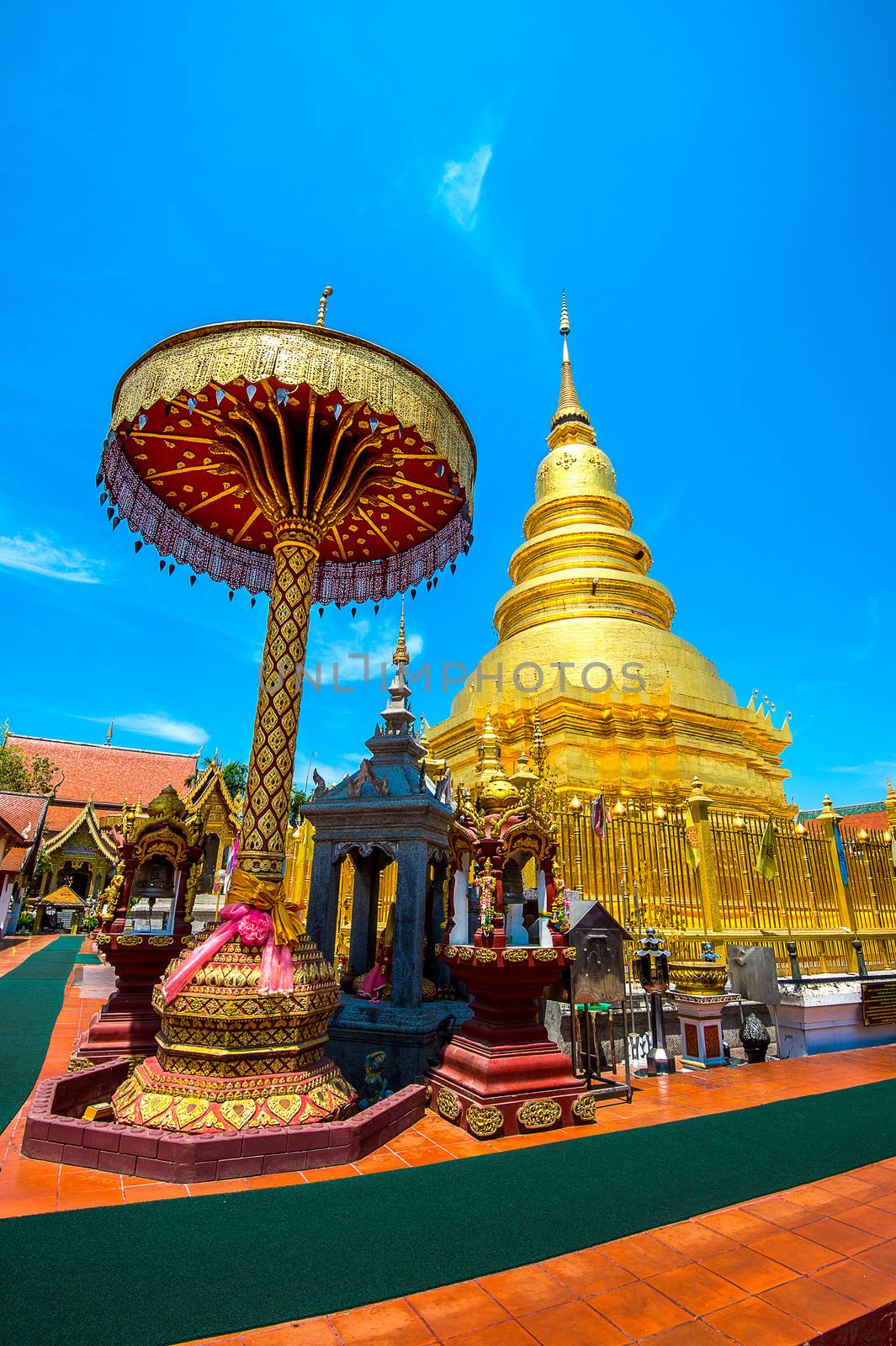 Wat Phrathat Hariphunchai Golden pagoda in Lamphun,Thailand. by gutarphotoghaphy