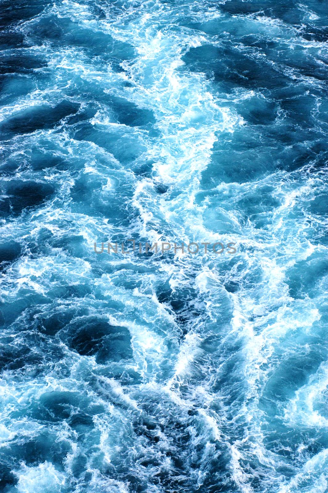 Blue white and black background of ship trail at sea