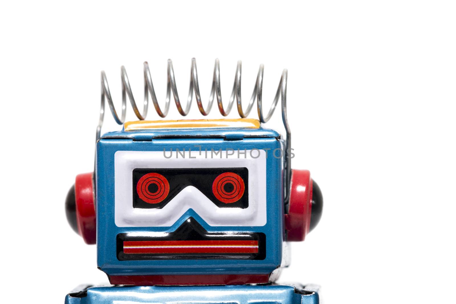 Vintage tin robot toy isolated on a white background.