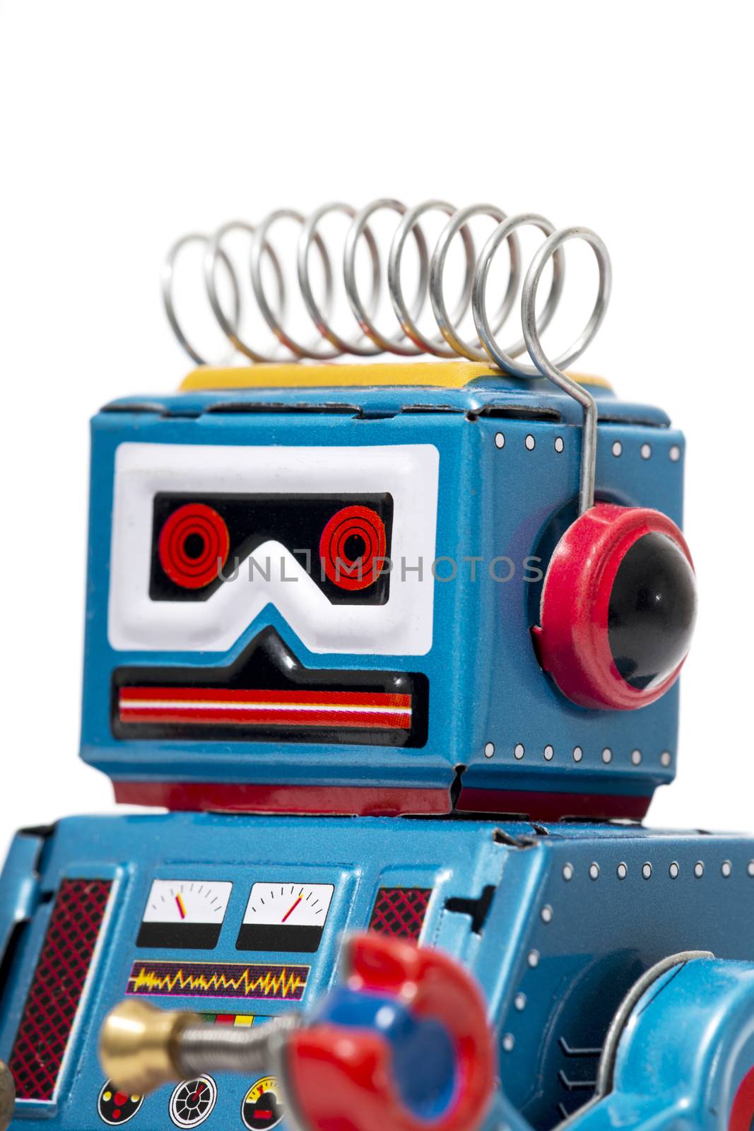 Vintage tin robot toy isolated on a white background.