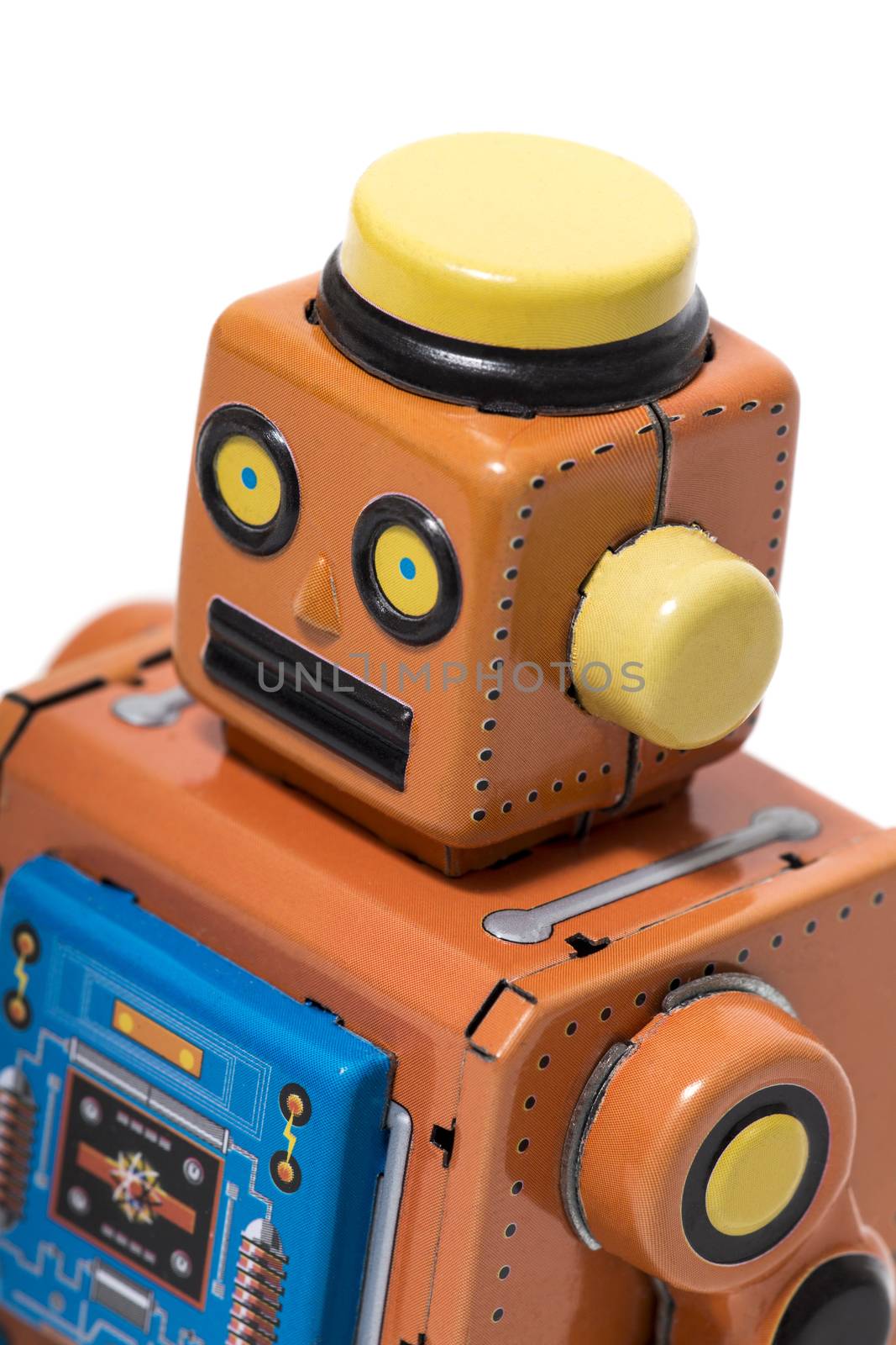 Vintage tin robot toy isolated on a white background.