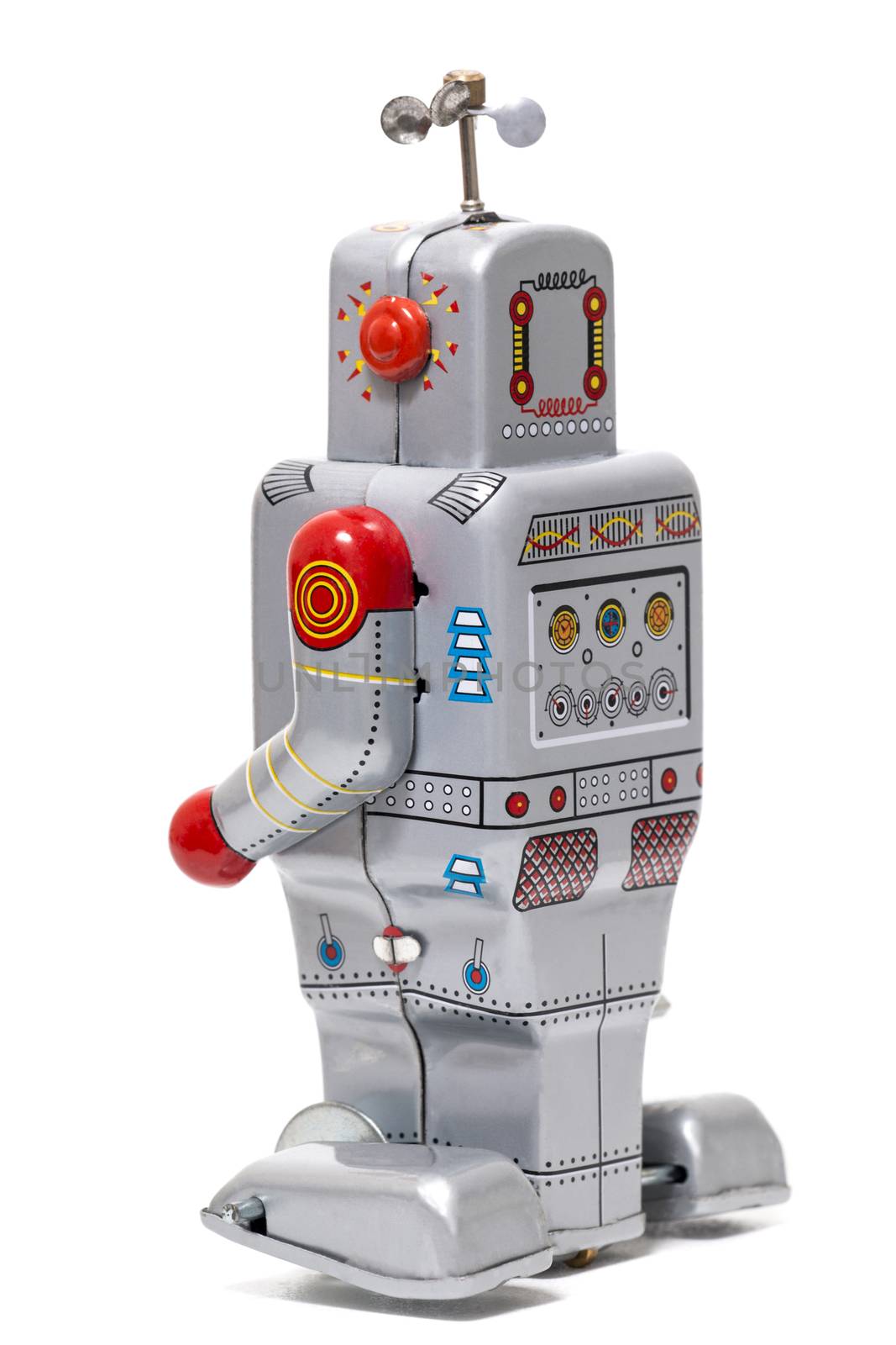 Vintage tin robot toy isolated on a white background.