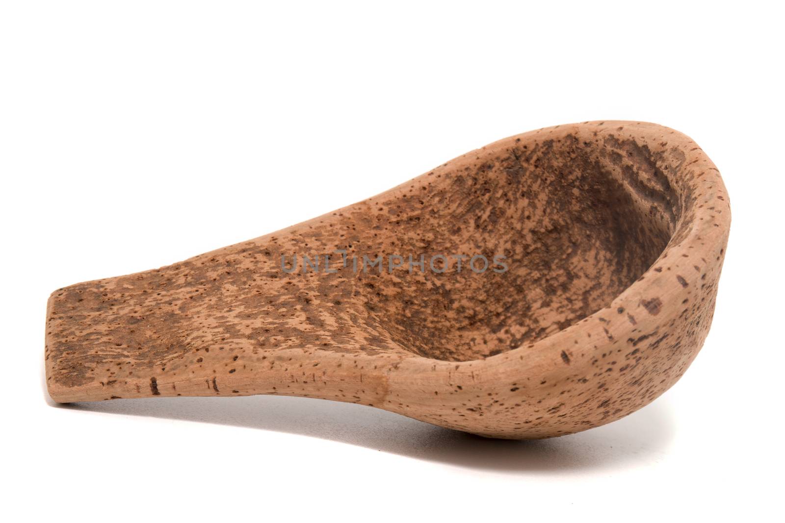 Close up view detail of a traditional handmade drinking utensil called "cocho" or "cocharro" carved from cork from the interior regions of Portugal.