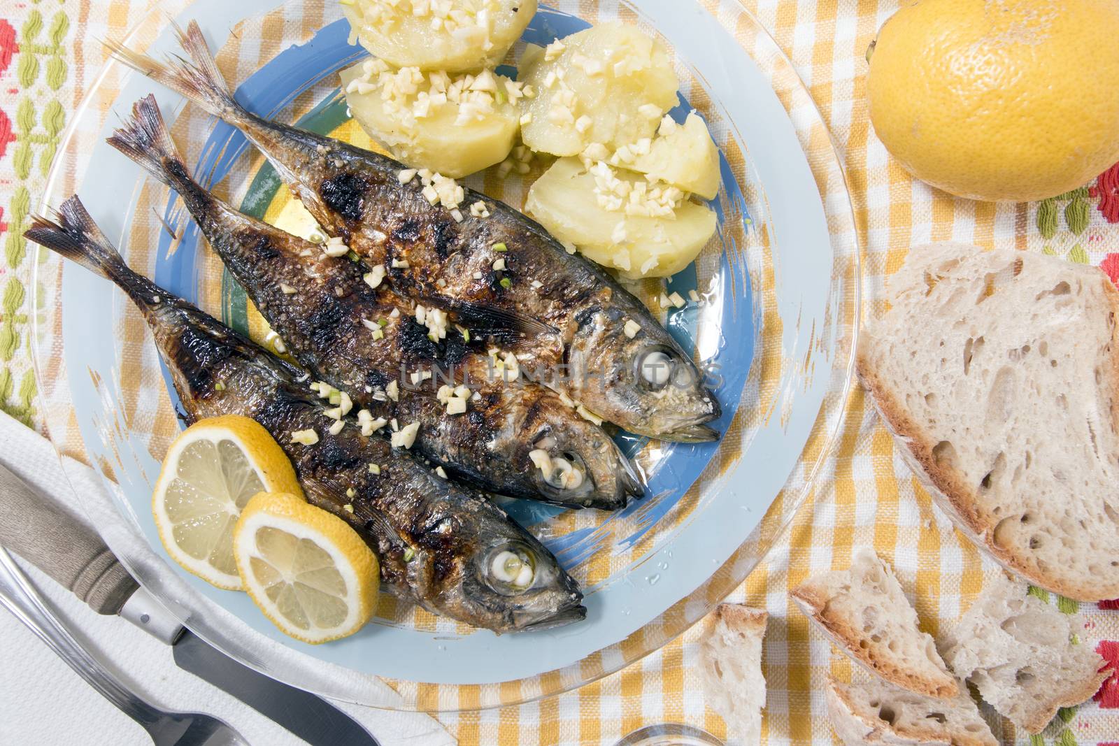 Grilled atlantic horse mackerel meal with potatoes.