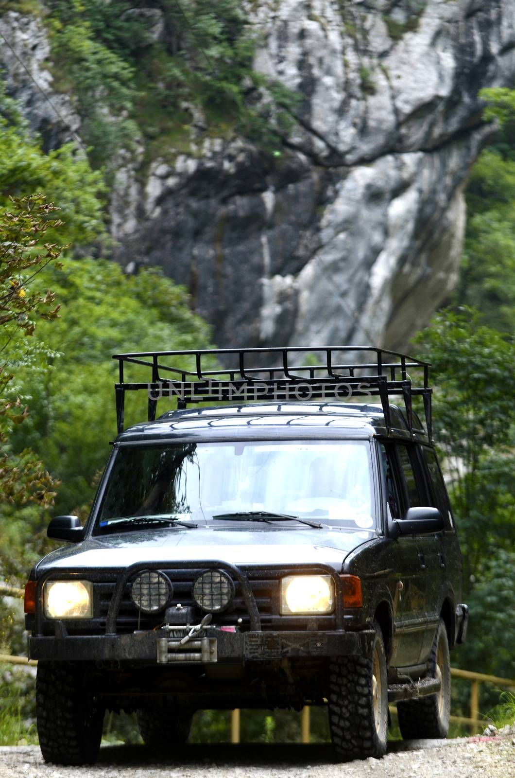 Off road vehicle passing gorge on the mountain