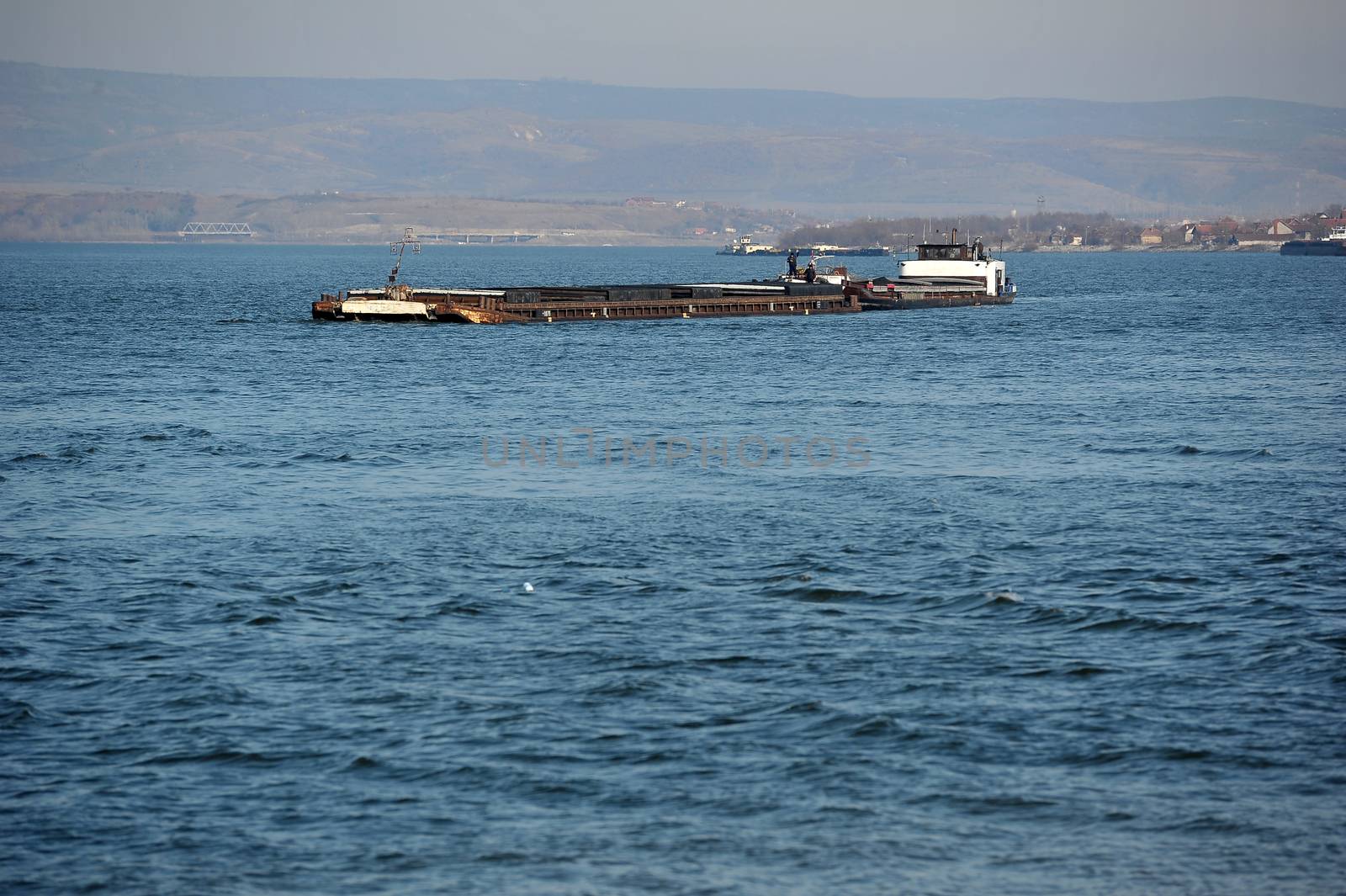 Cargo ship on the way to main river port