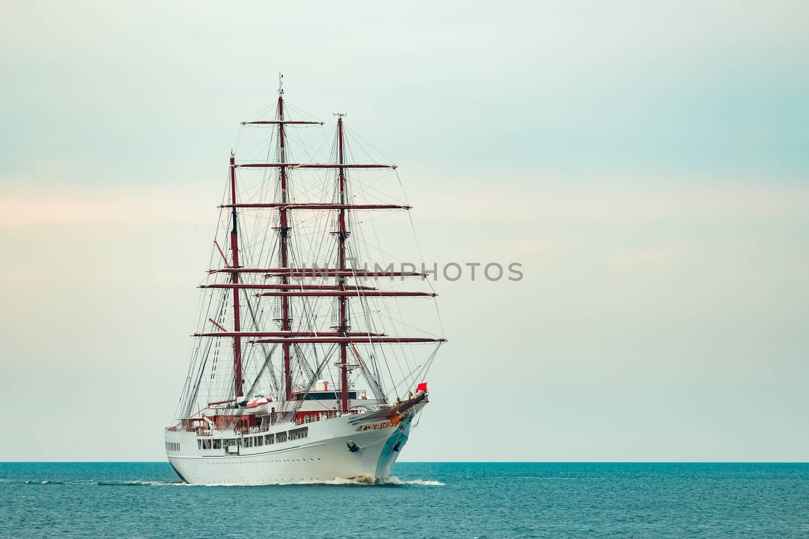 Big white sailing ship with three mast moving to the Riga port