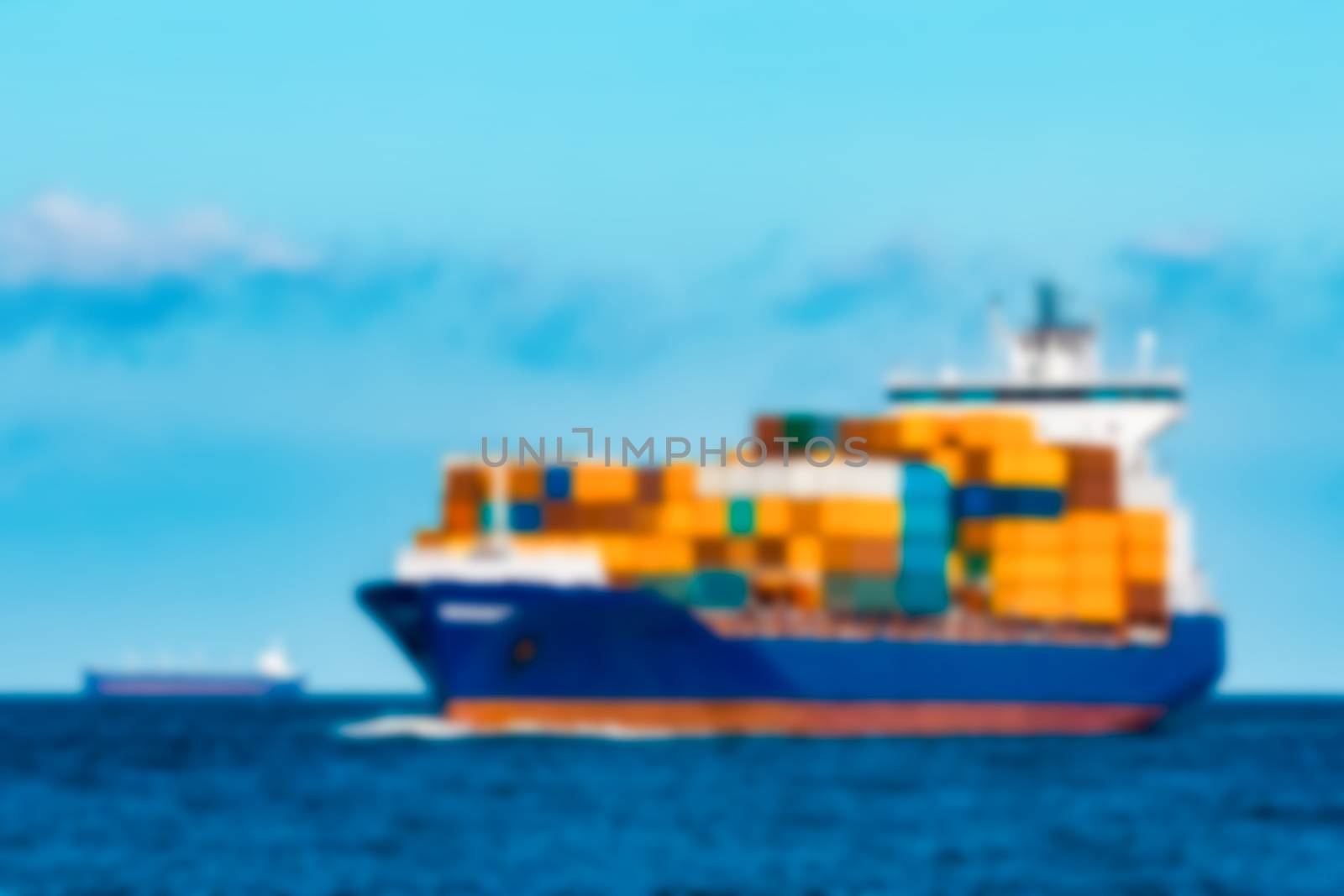 Blue cargo ship - soft lens bokeh image. Defocused background