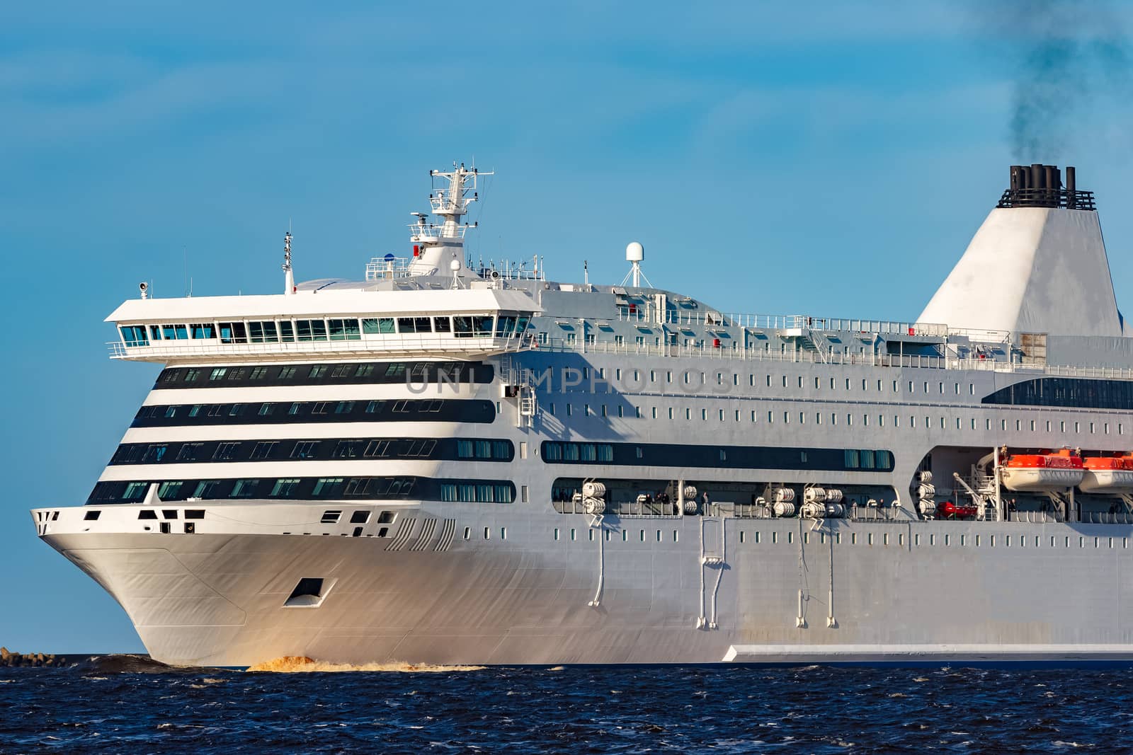 White cruise liner sailing on a clear day