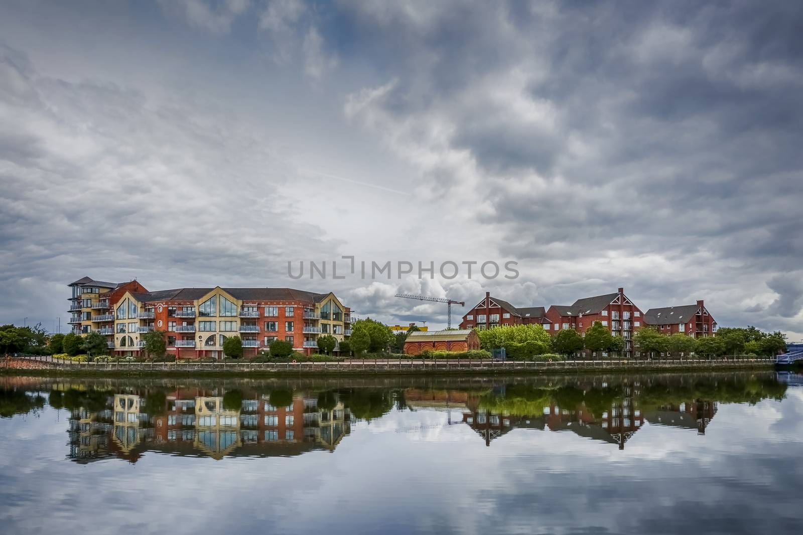 dramatic sky over modern appartaments blocks Greggs Quay and Laganview Court along river Lagan in Belfast, Northern Ireland, UK