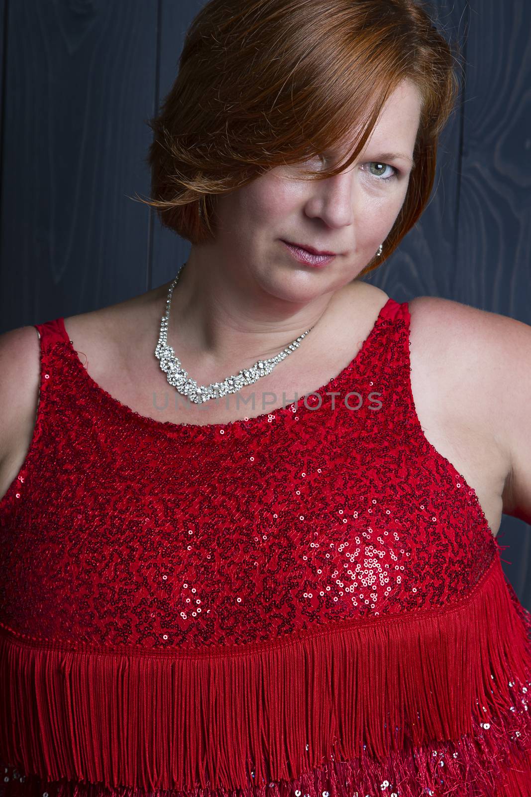 sexy forty year old woman wearing a sparkly dress