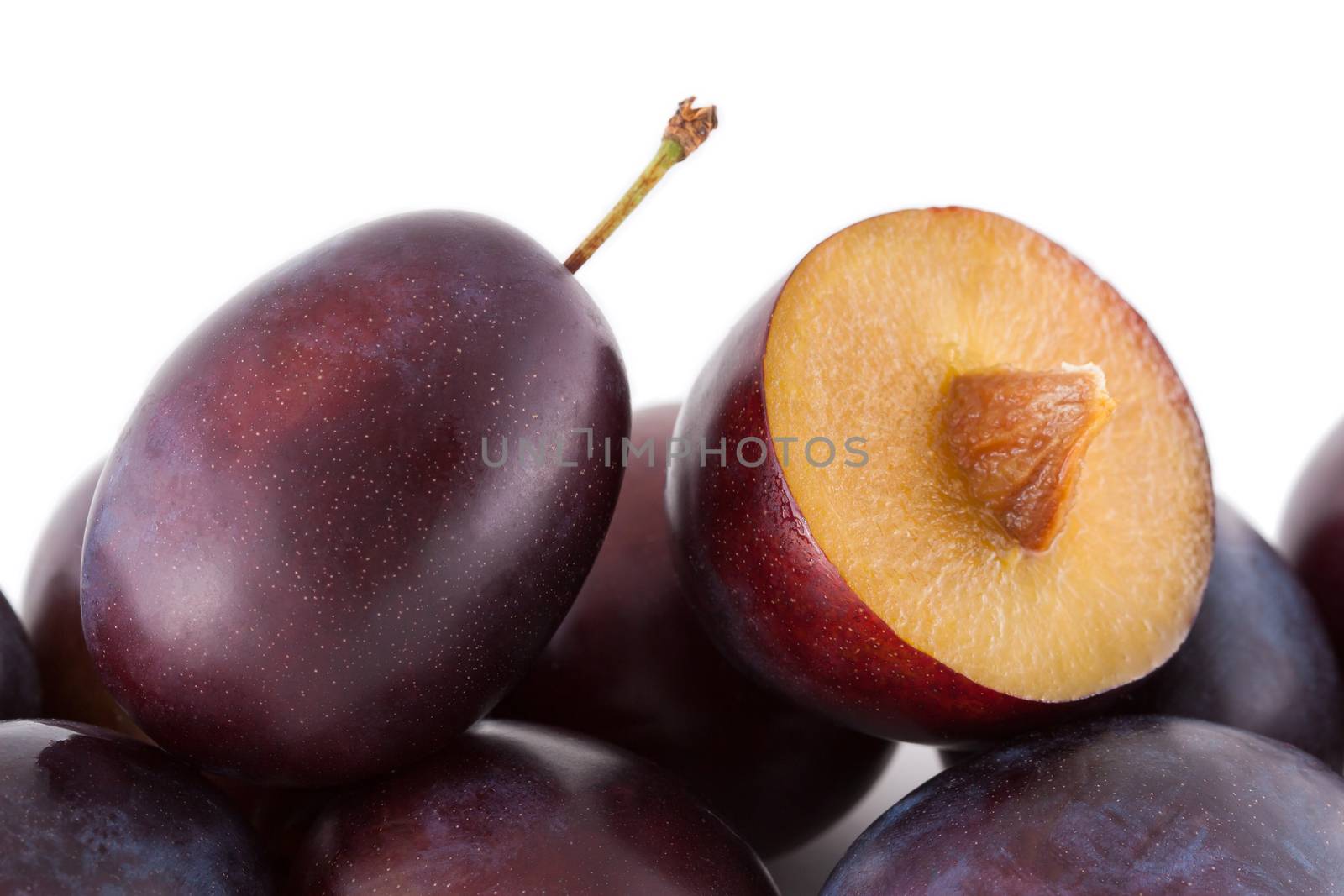 Fruits, plums isolated on white closeup