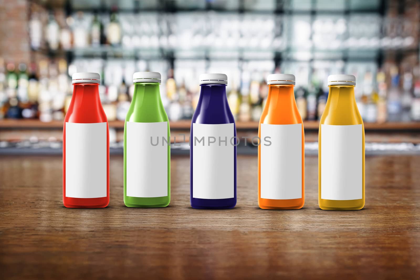 five multicolored bottles of juice are on the counter