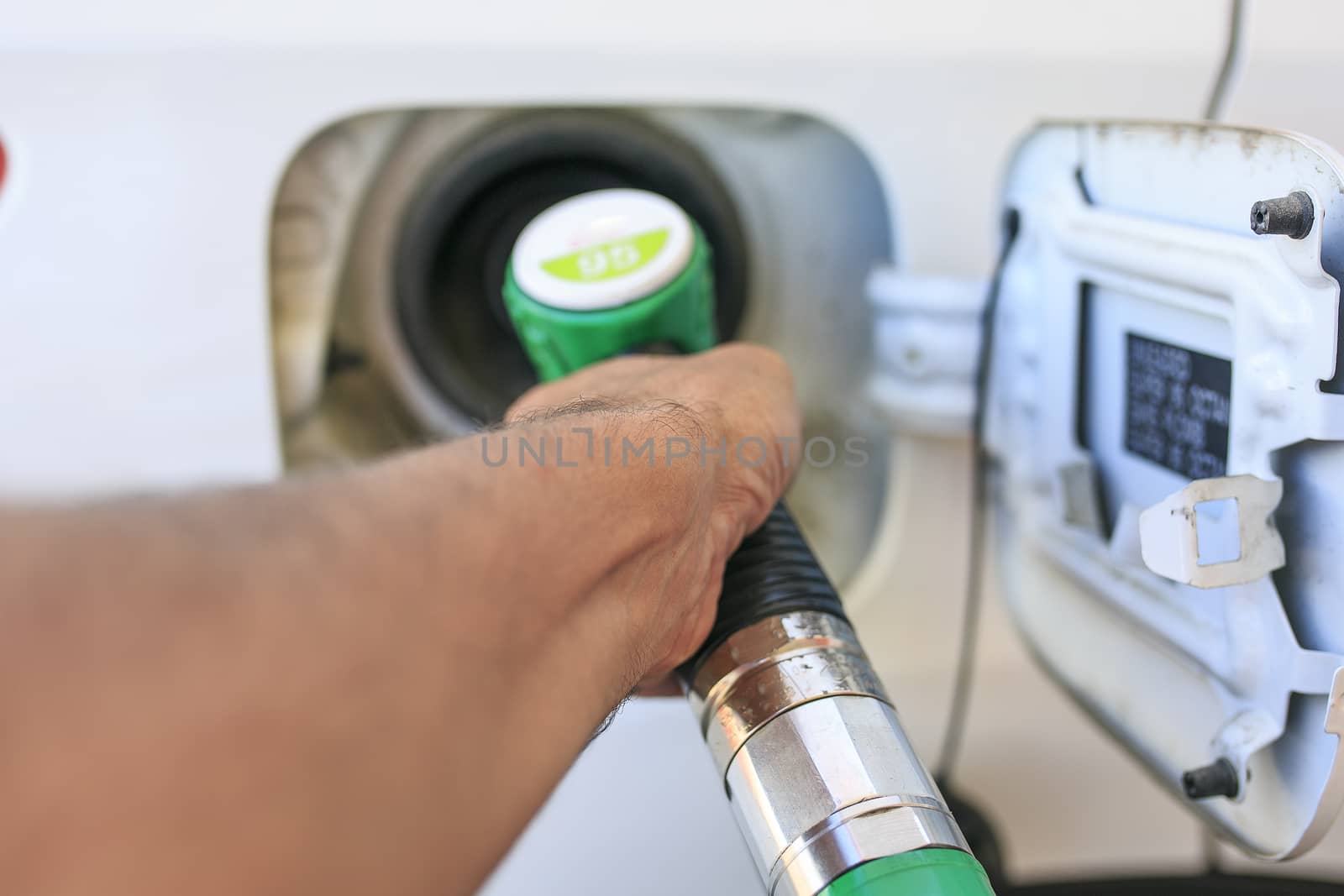 Man refilling his gasoline car by nachrc2001