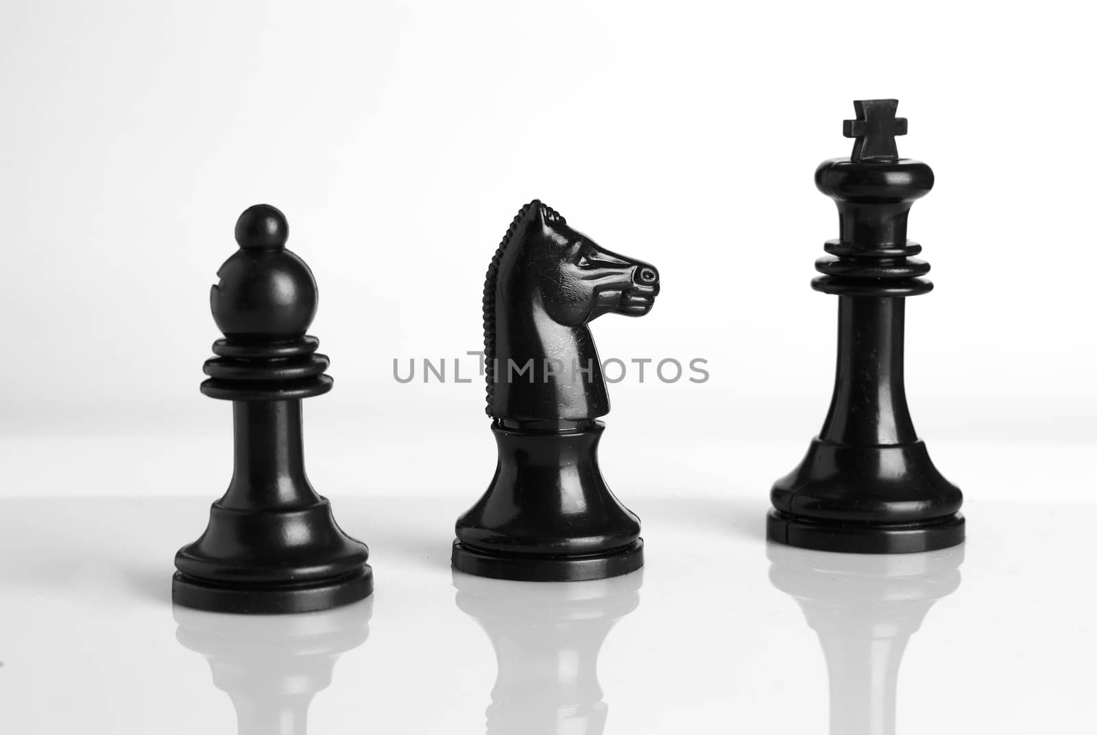 Isolated chess pieces in Black and white